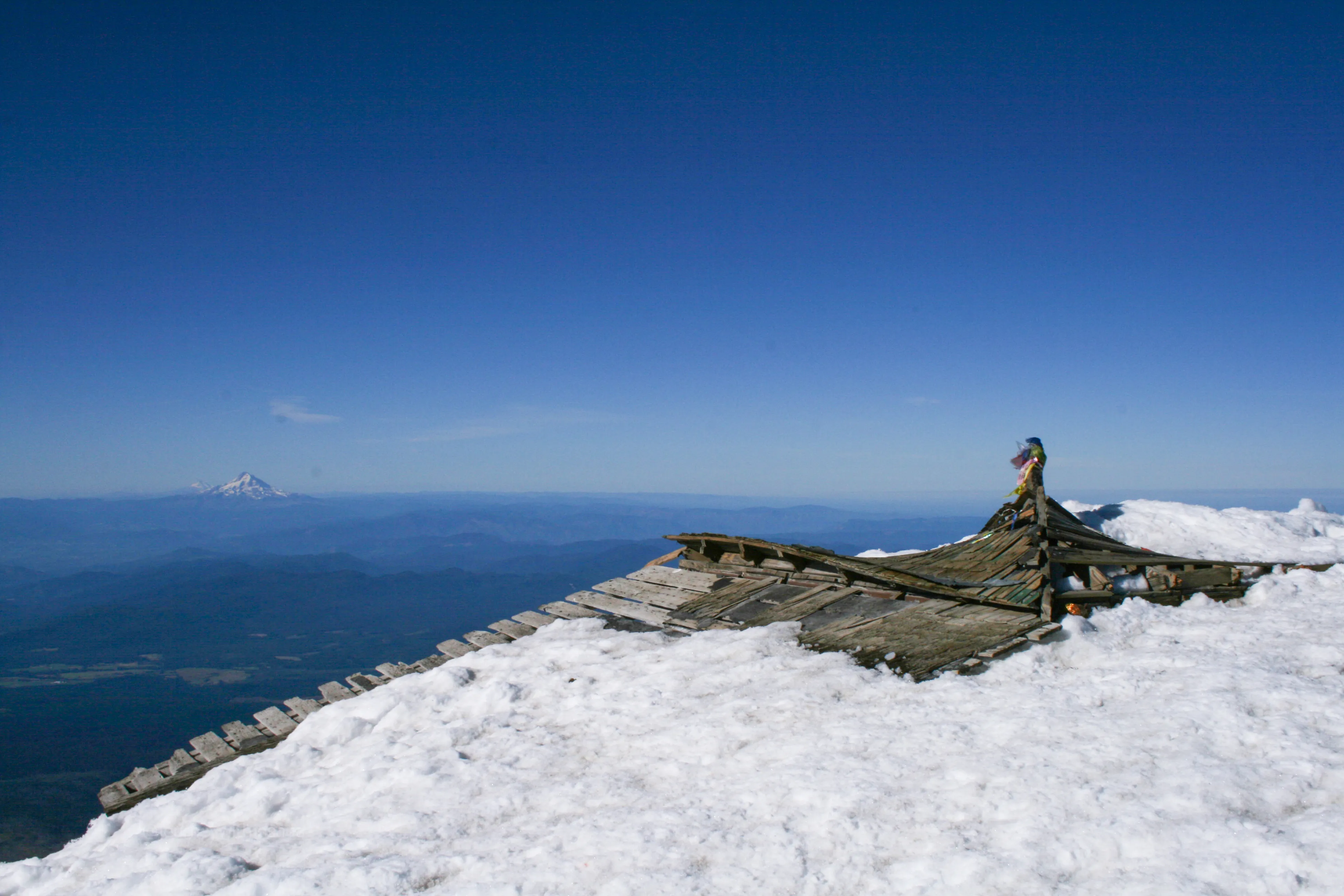 The old dilapidated shelter at the true summit of Mount Adams