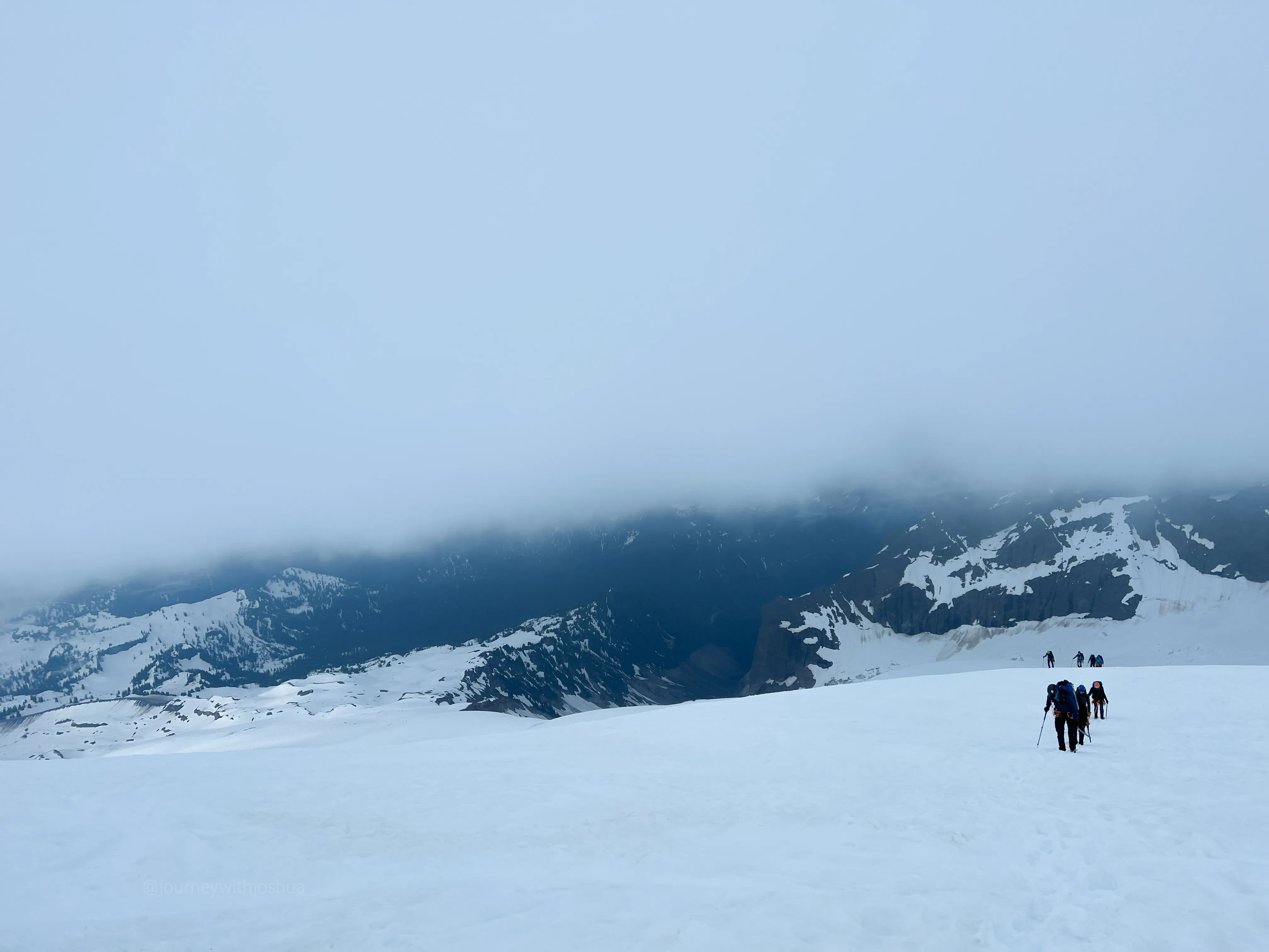 Climbing into thick cloud on the upper mountain