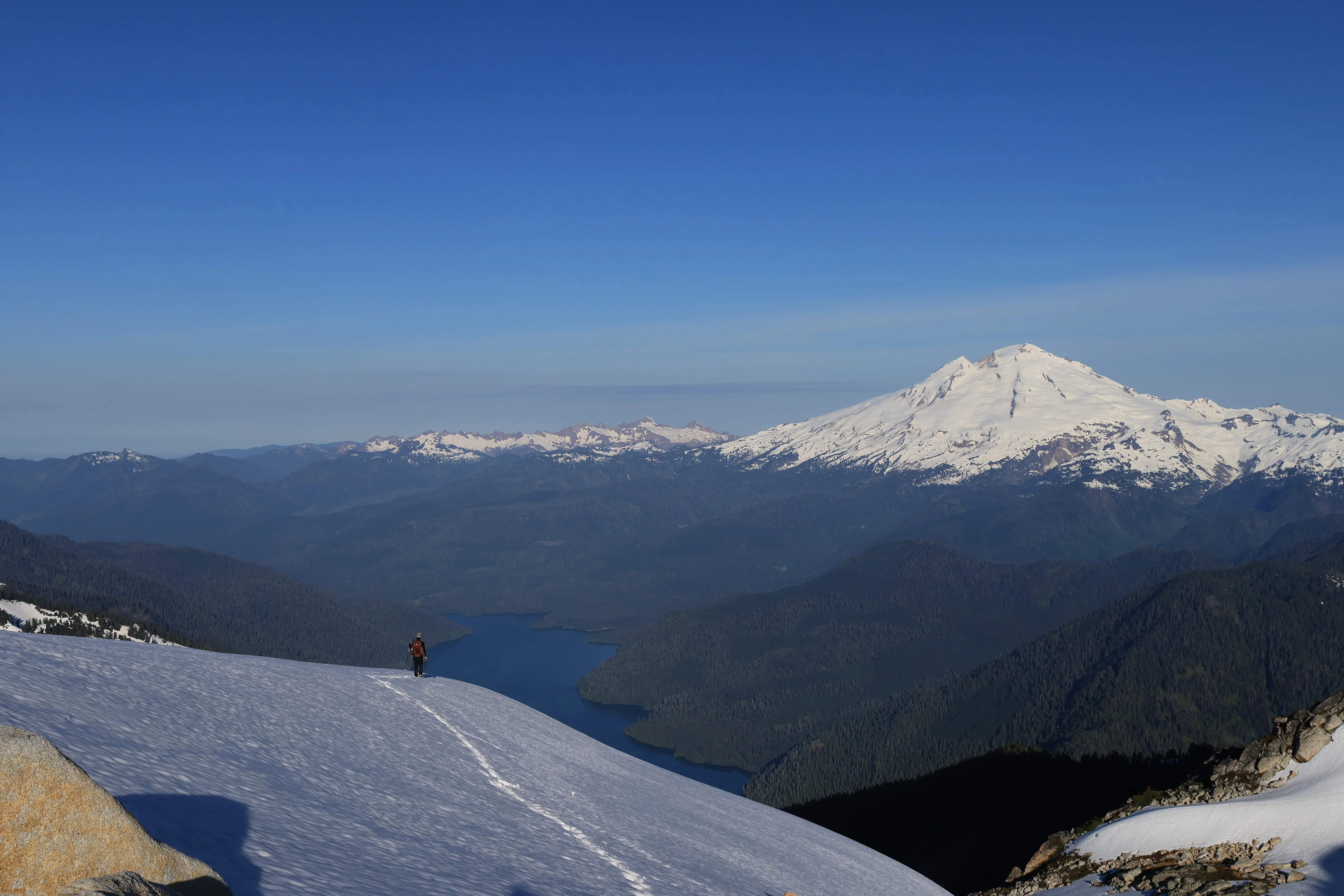 A small climber against a big landscape on the ridge above Baker Lake