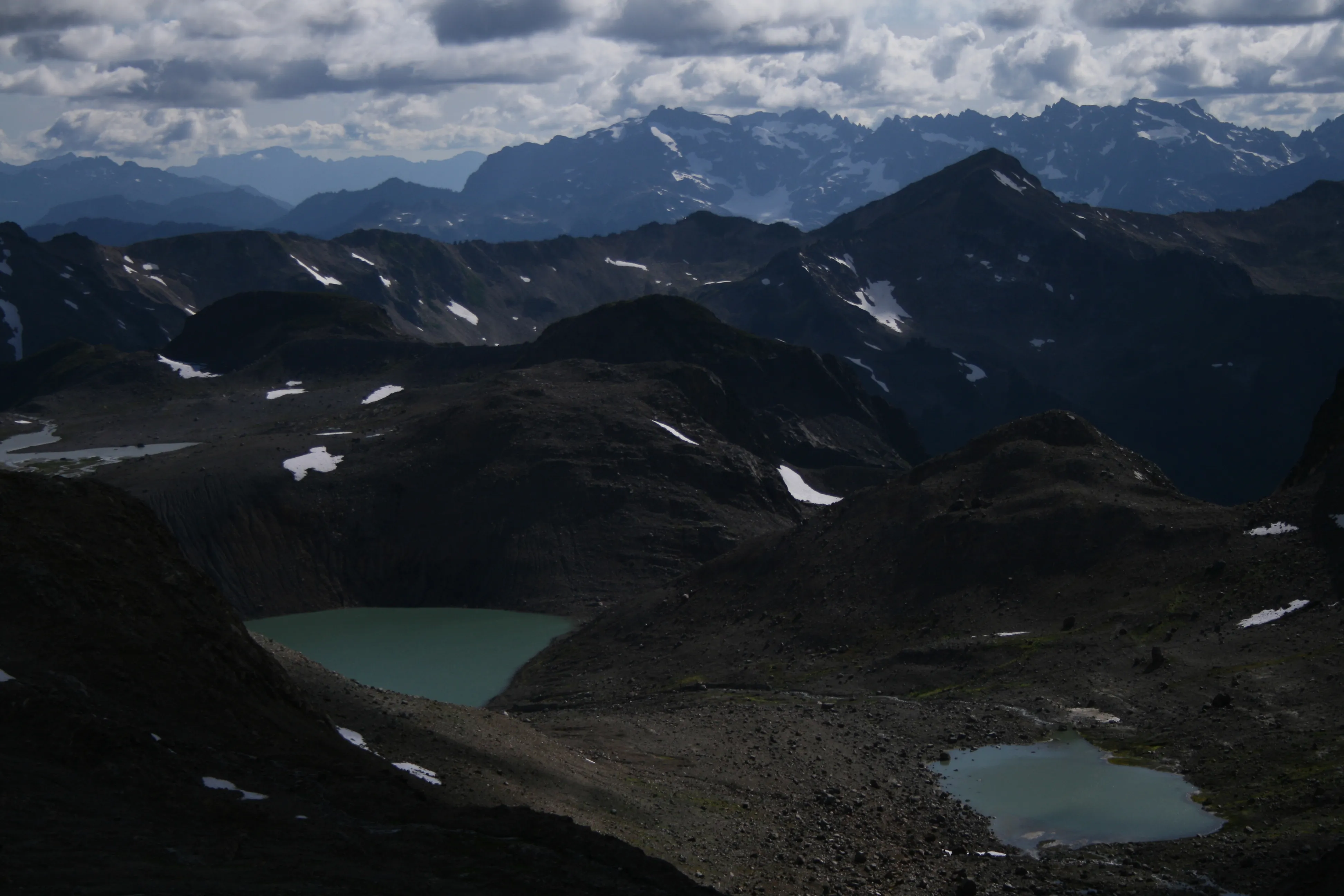 Alpine lakes, tarns, and lots more mountains from the top