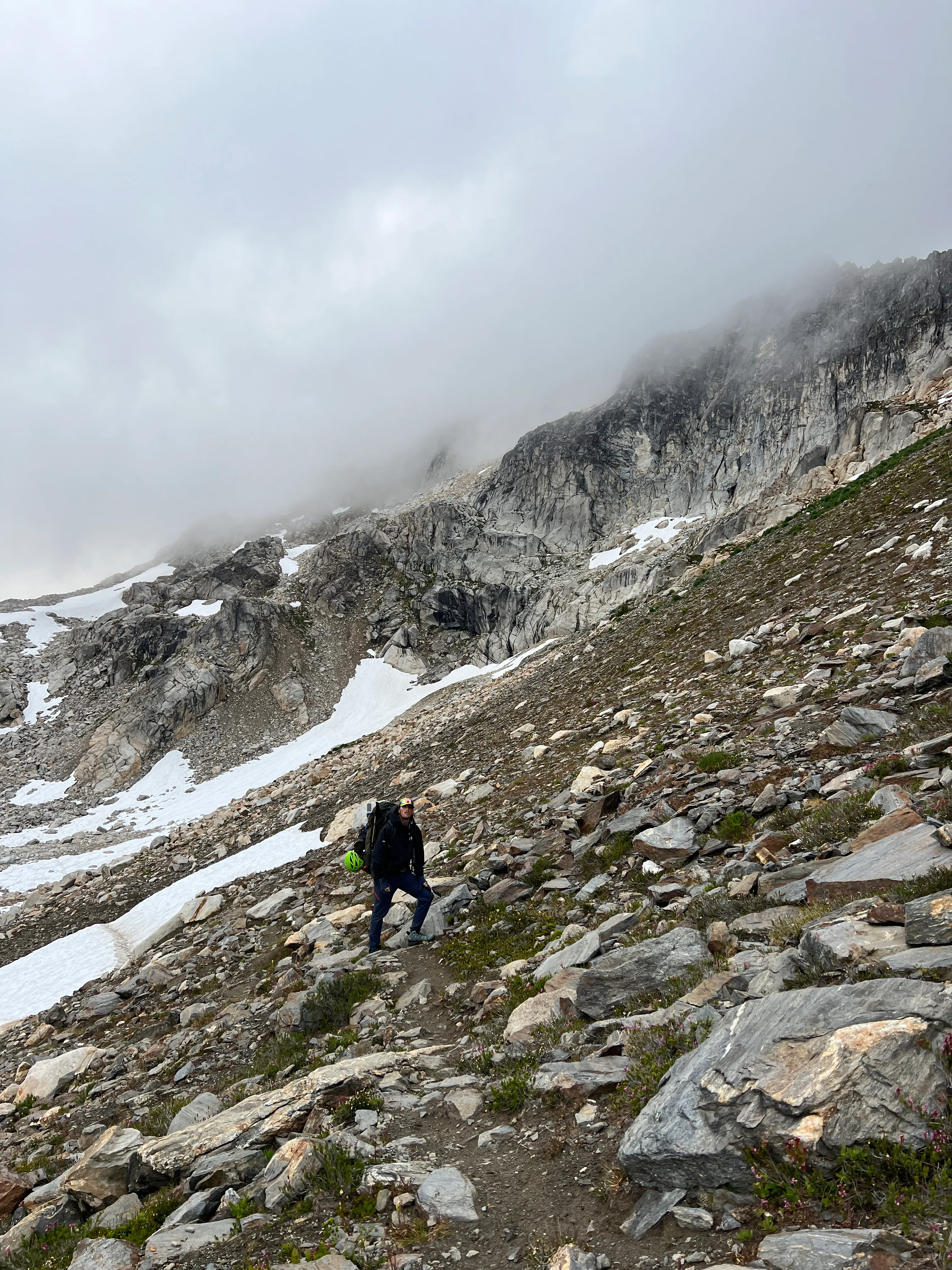 Fog rolling into the rocky basin below White Pass