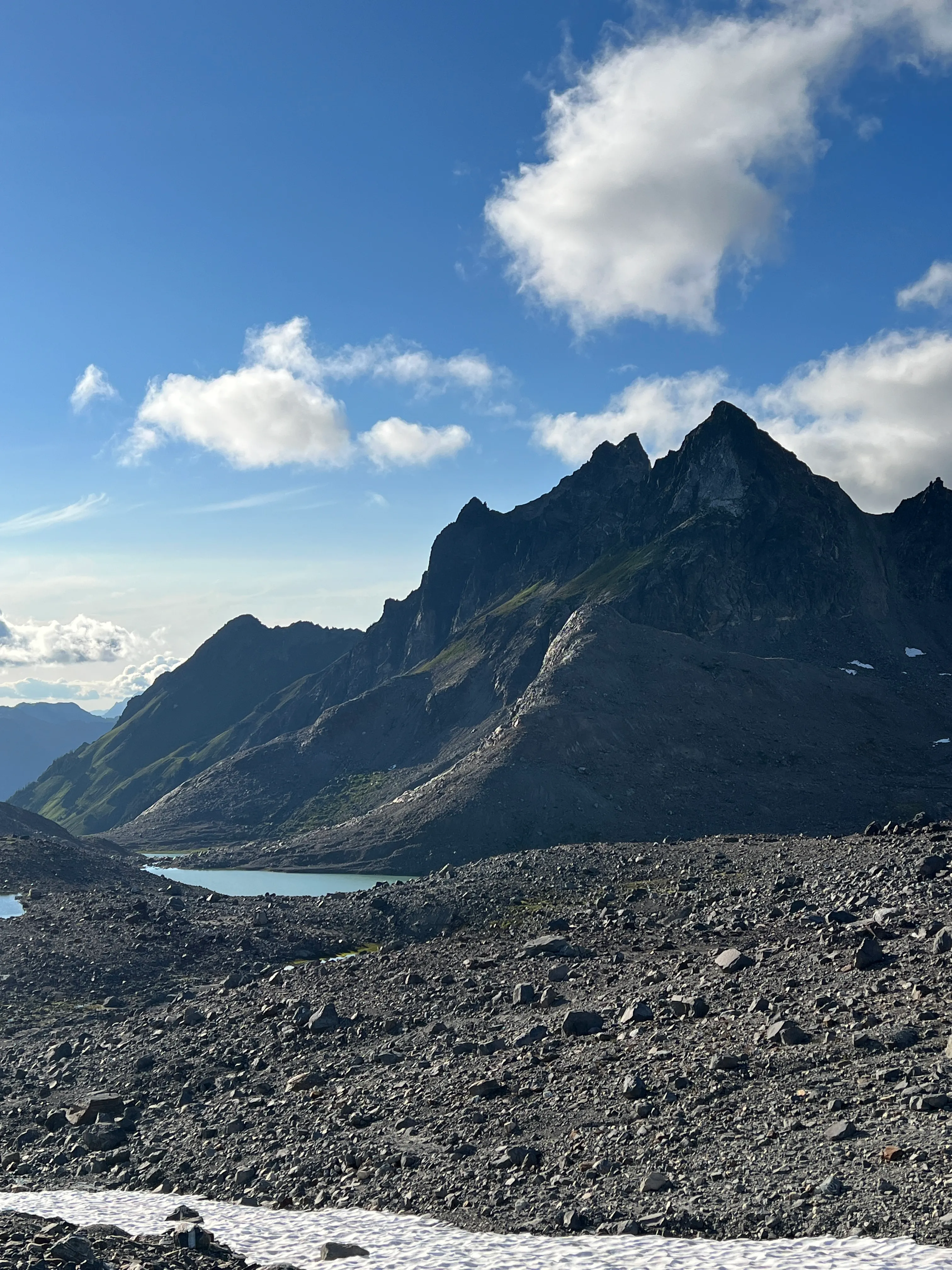 Mountains and alpine lakes spread out below the high camp