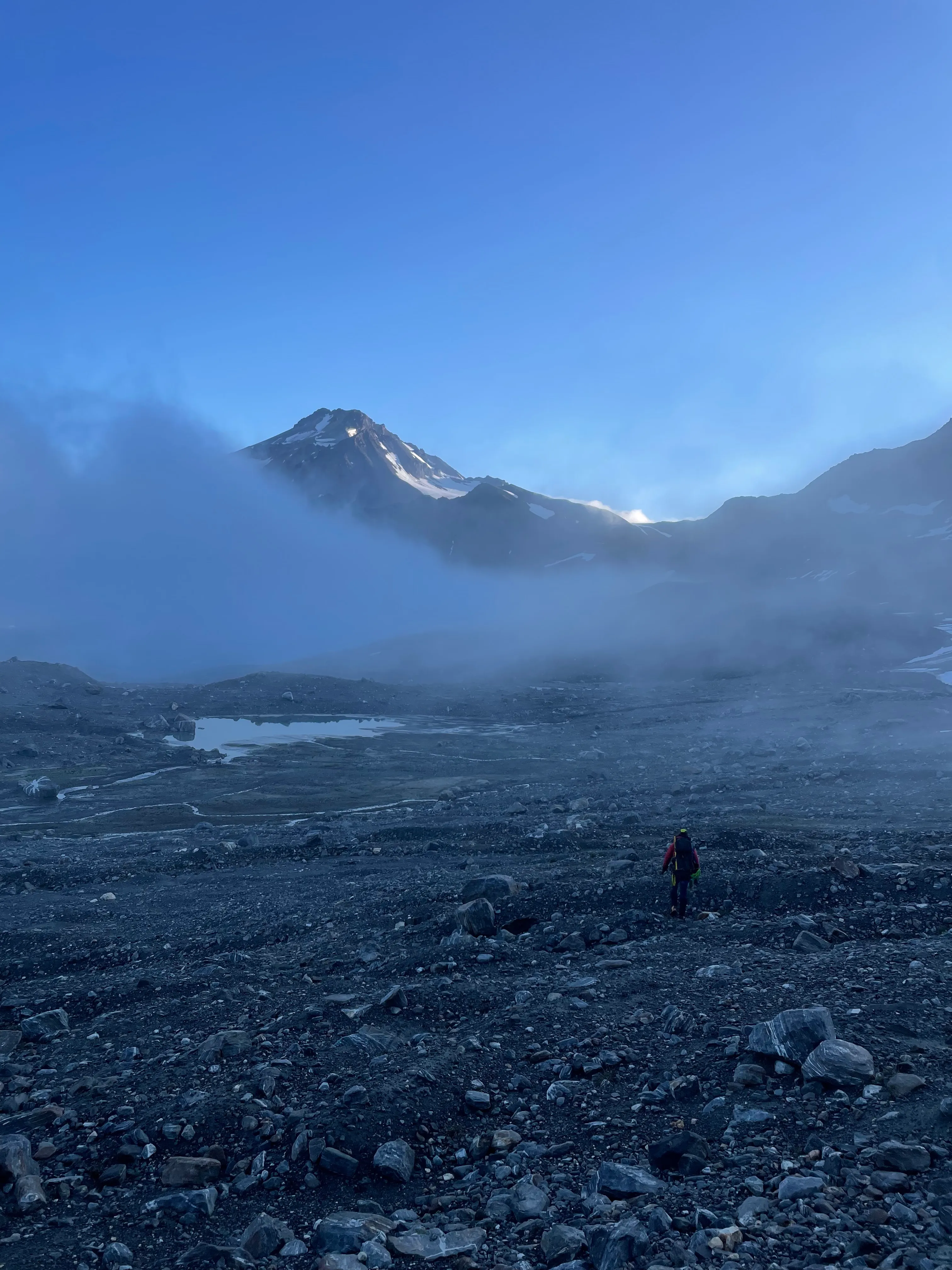 Walking through no man's land of rock and snow to start summit day