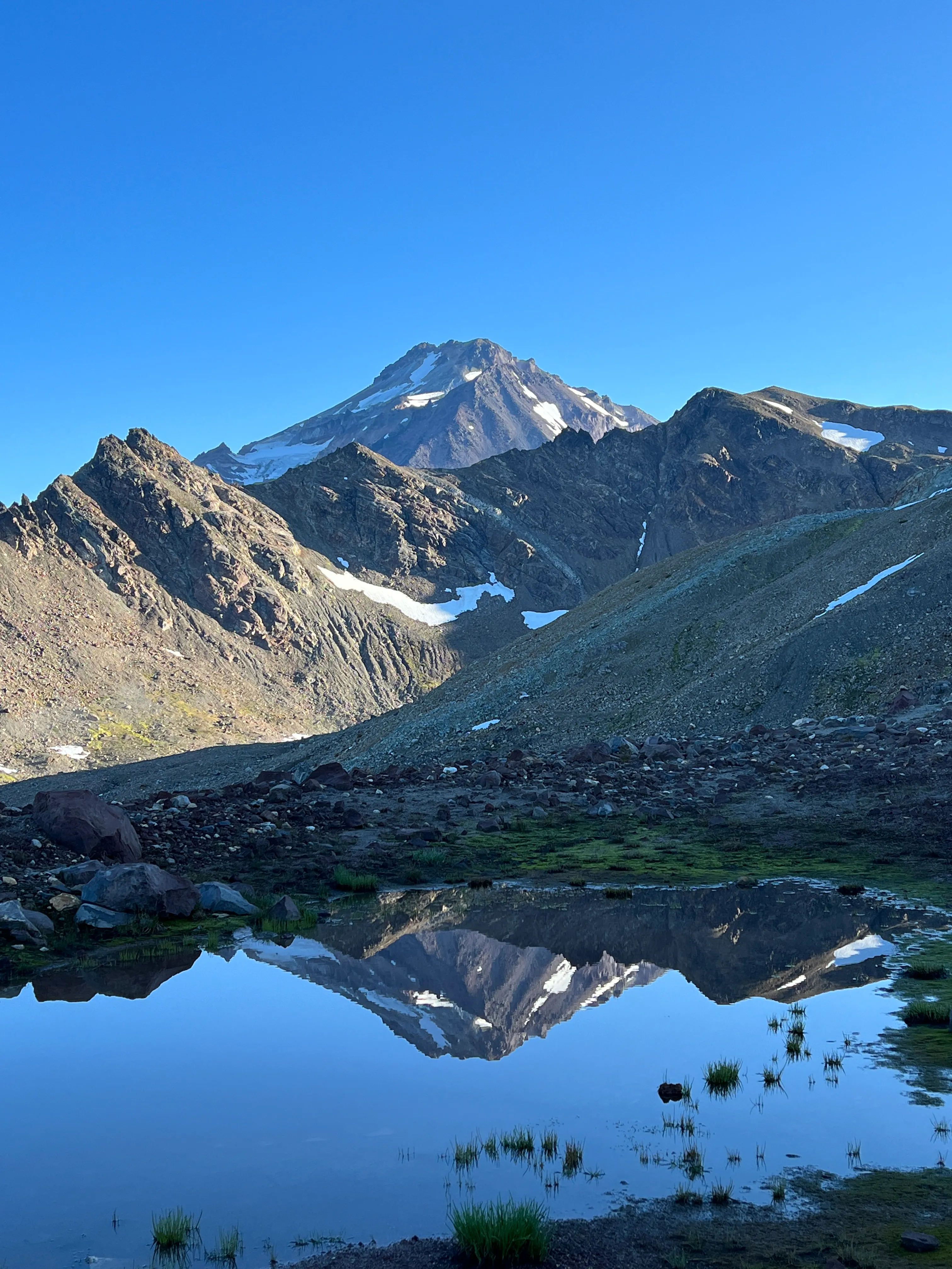 Glacier Peak reflected in a still tarn, reflections of Dakobed