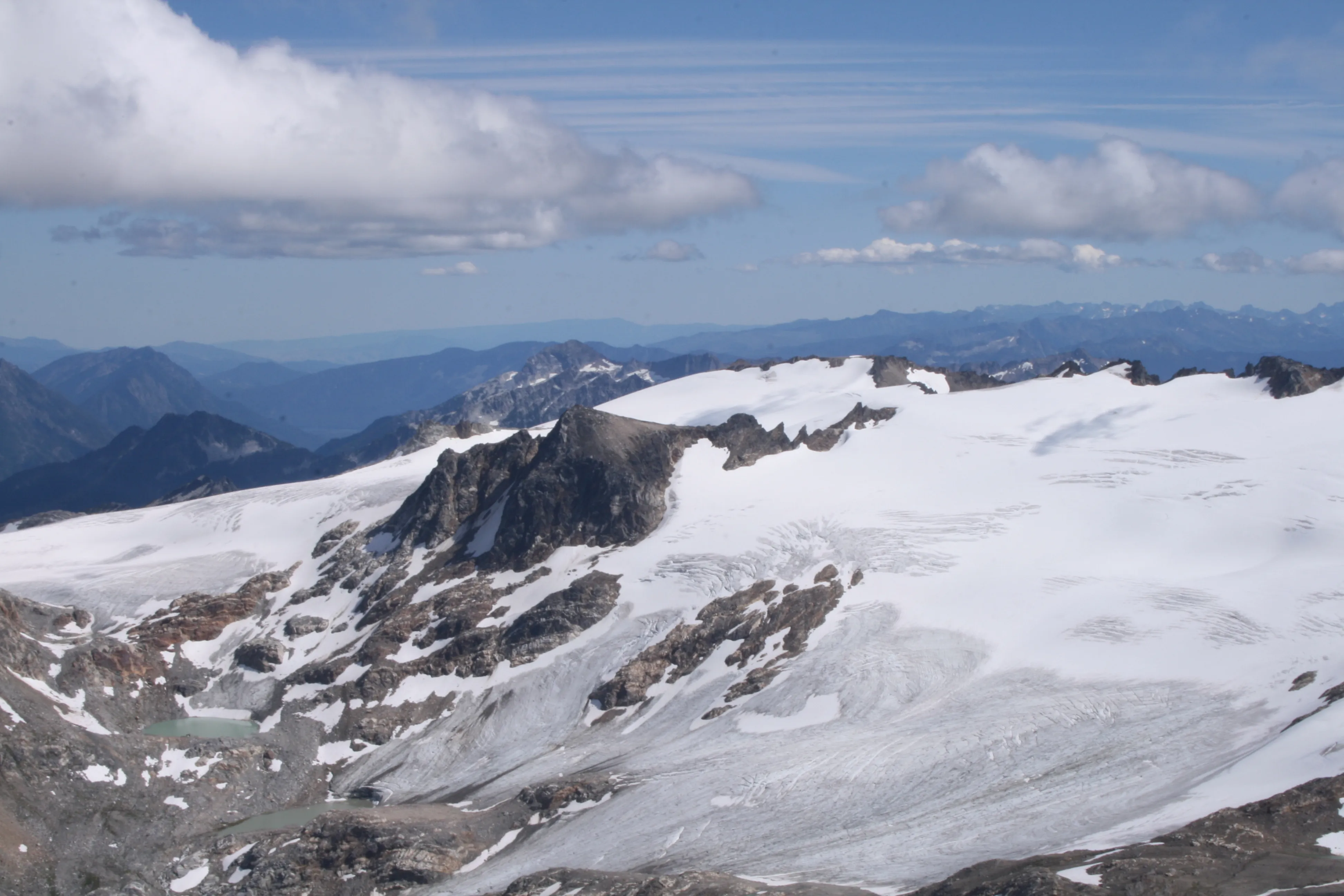 Humbling summit views of tarns, glaciers, and surrounding peaks