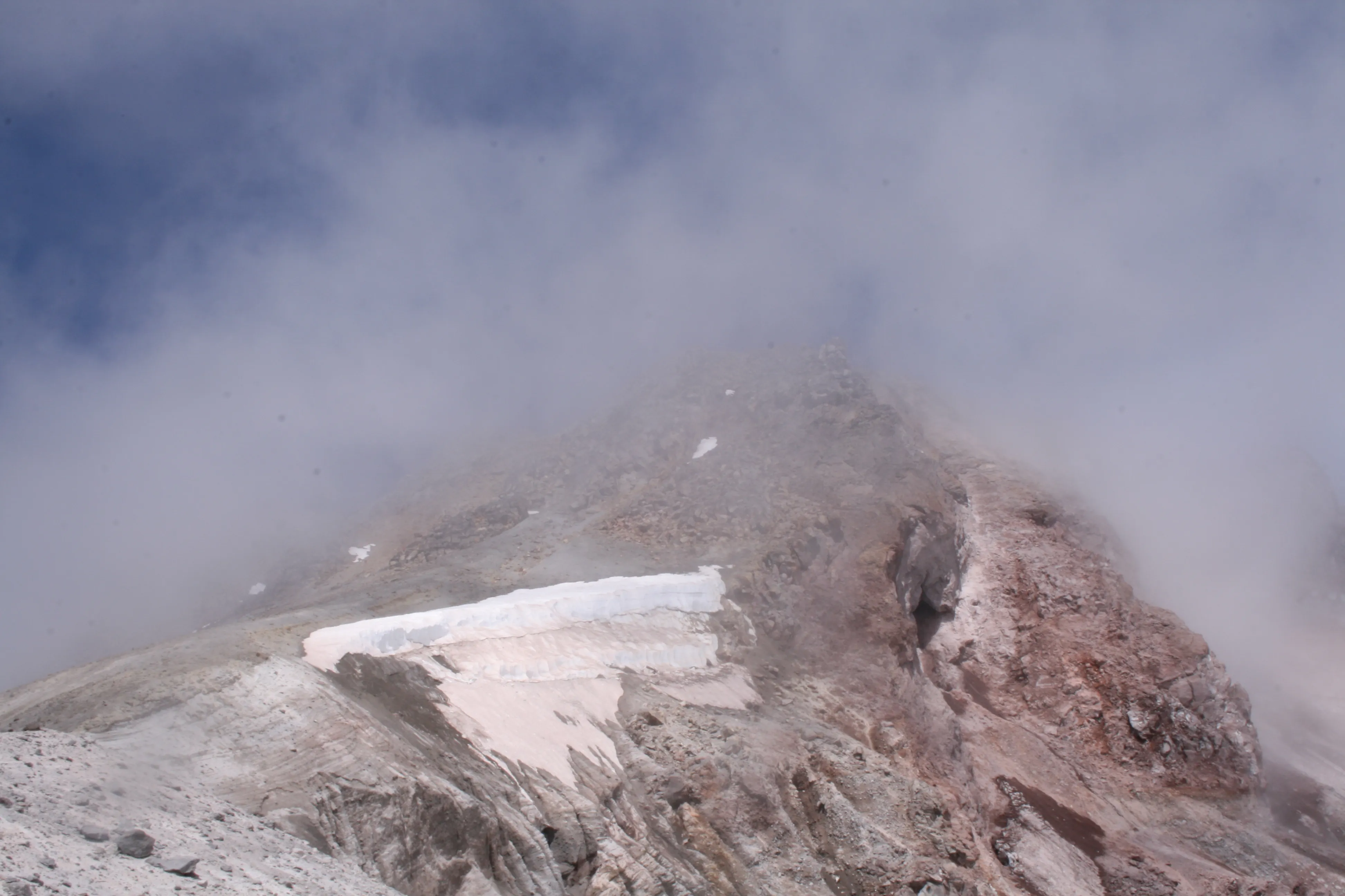 The true summit concealed in thin fog, getting closer now