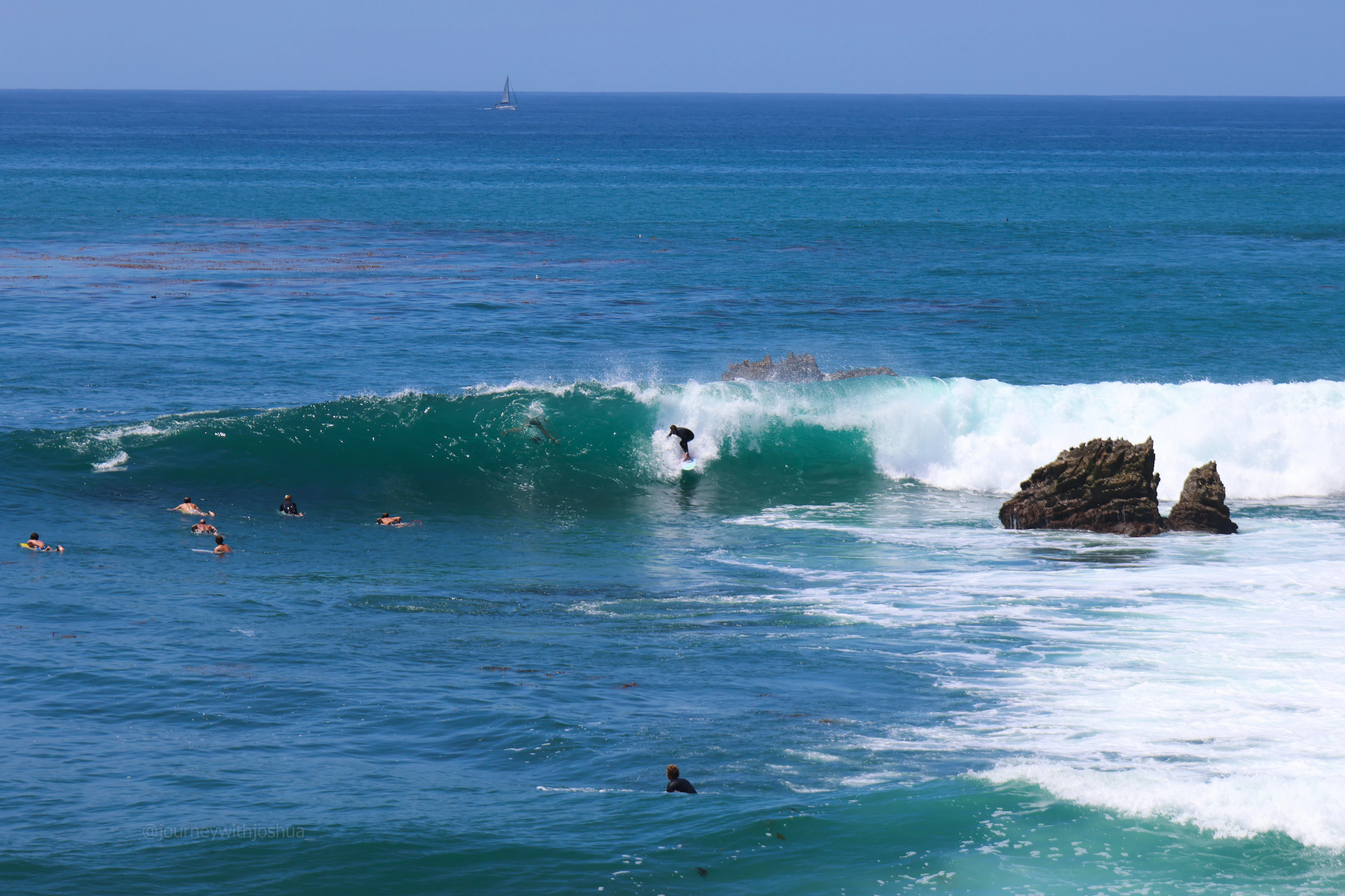 Surfers ripping the hurricane swells at Laguna Beach.