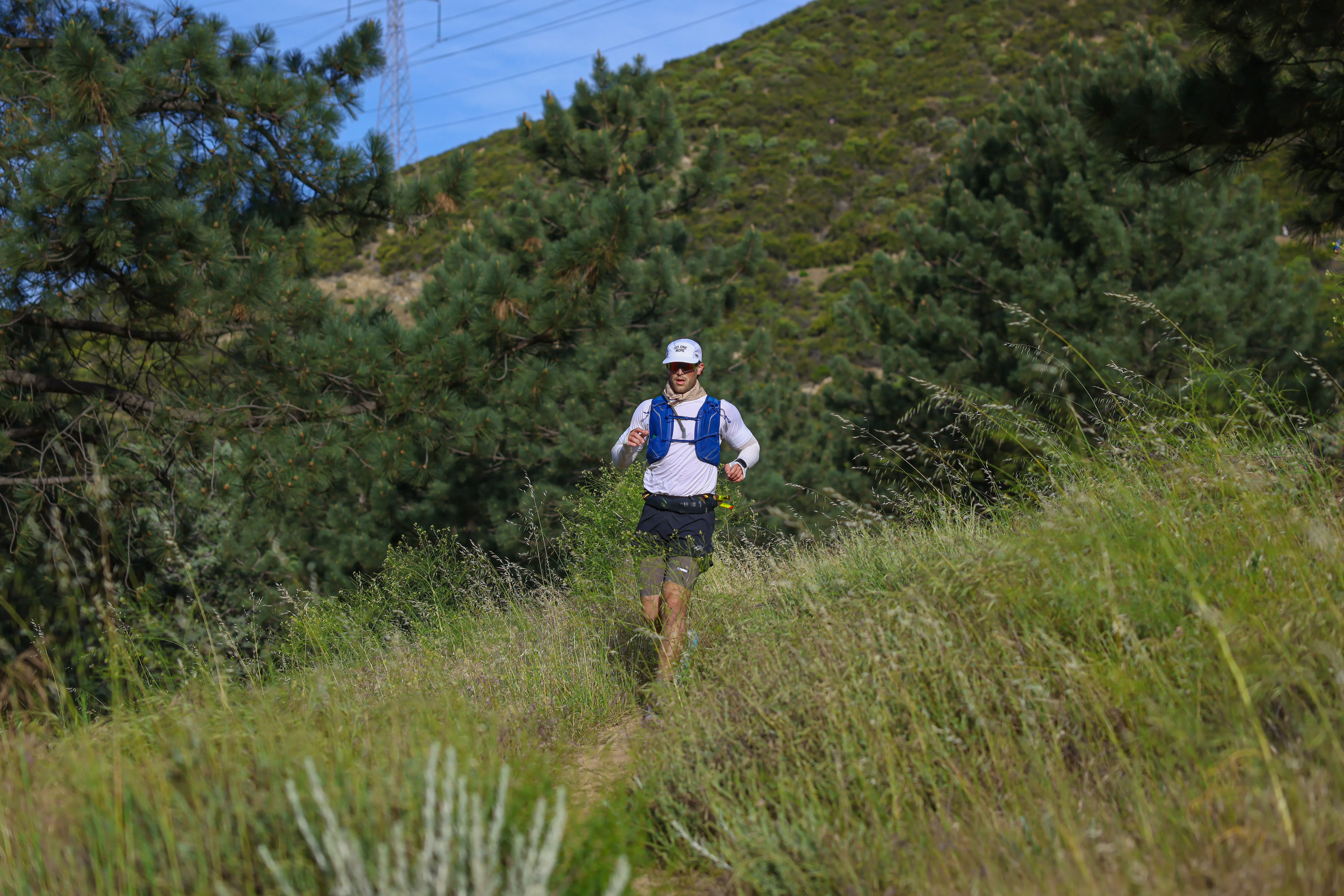 Racing through the first aid station at the Leona Divide 100K