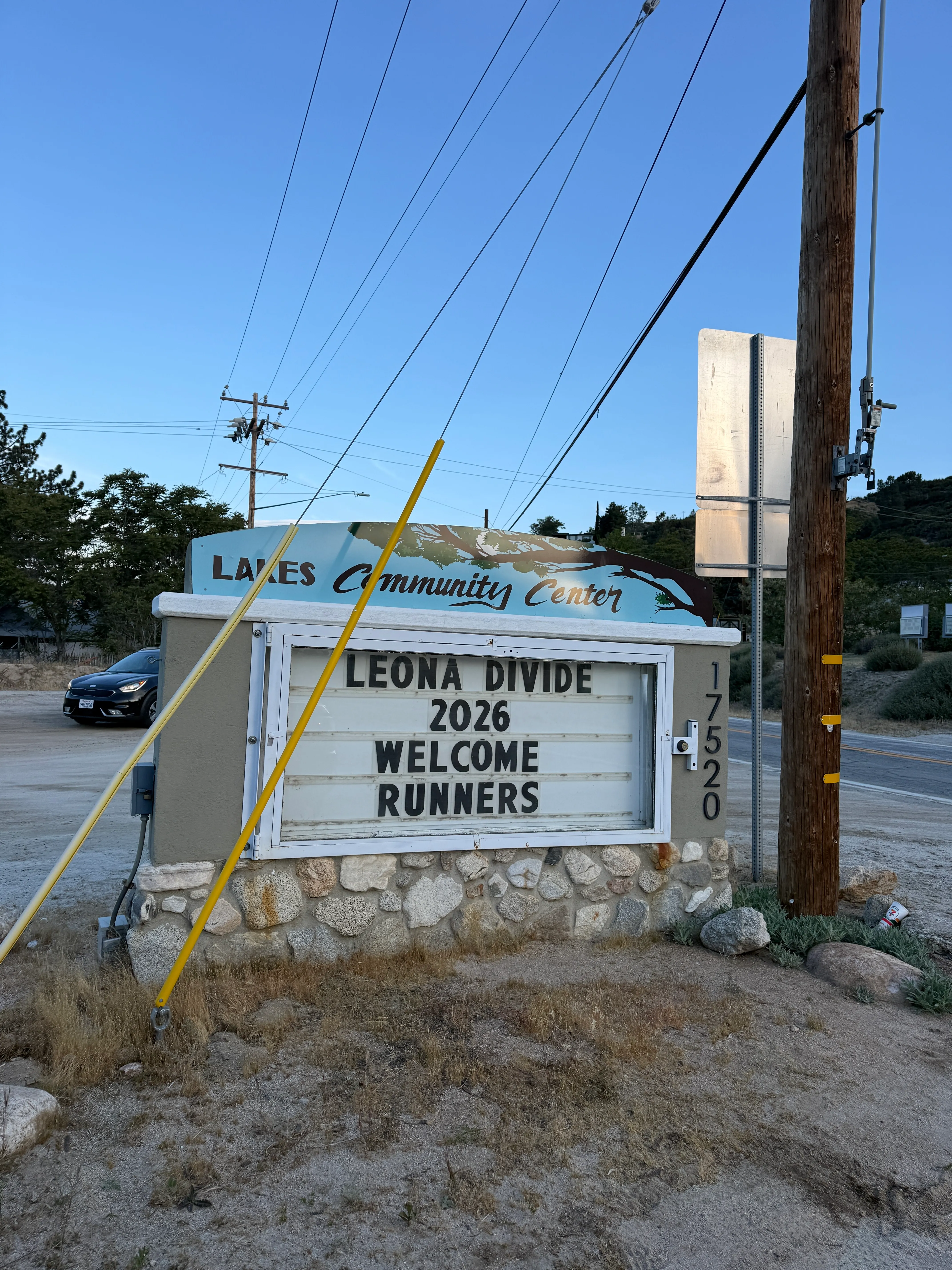 The welcome sign outside the old schoolhouse at the Leona Divide start