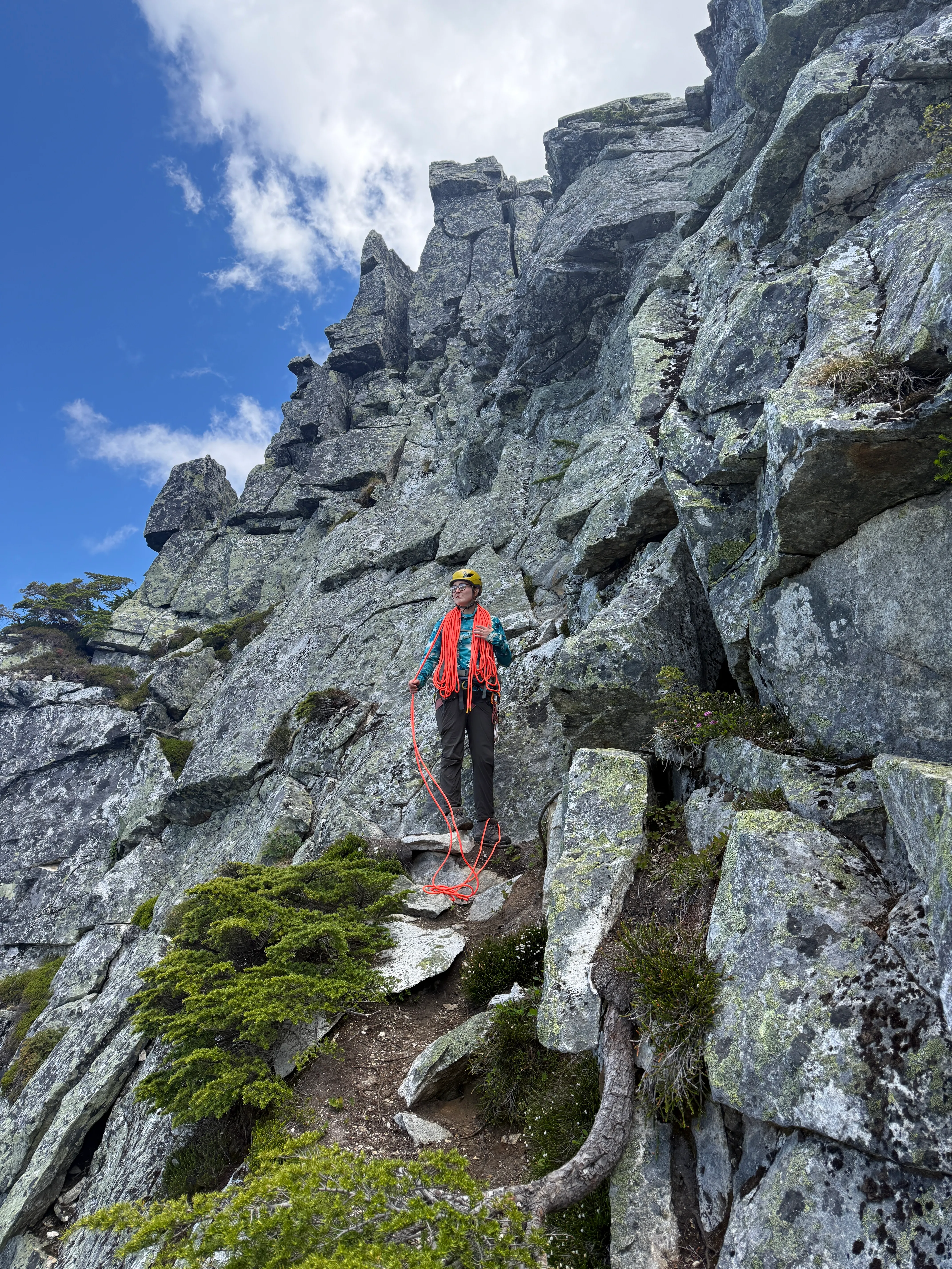 Professional rope coiler at work after the rappels