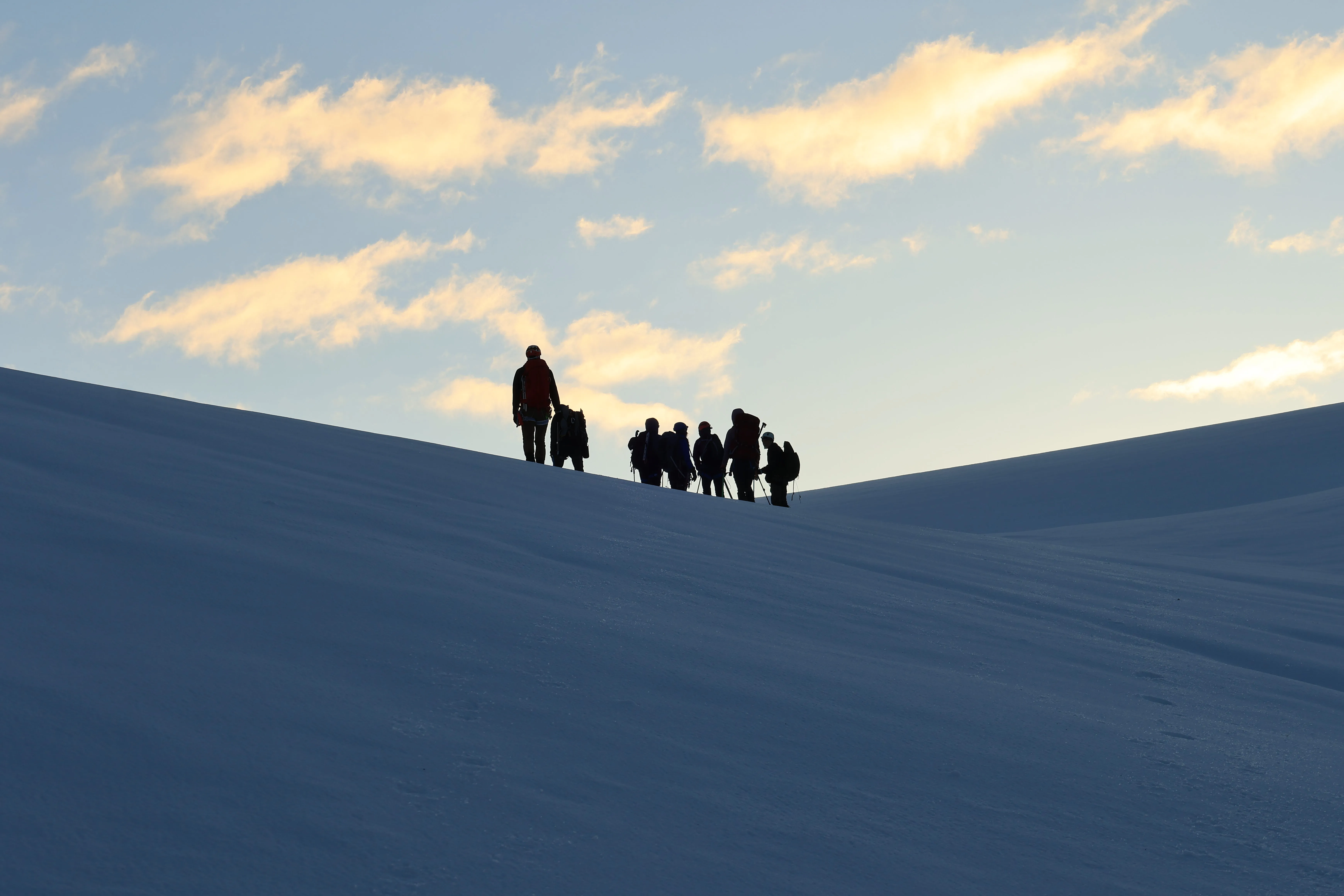 Climbers silhouetted after reaching the Mamquam icefield.