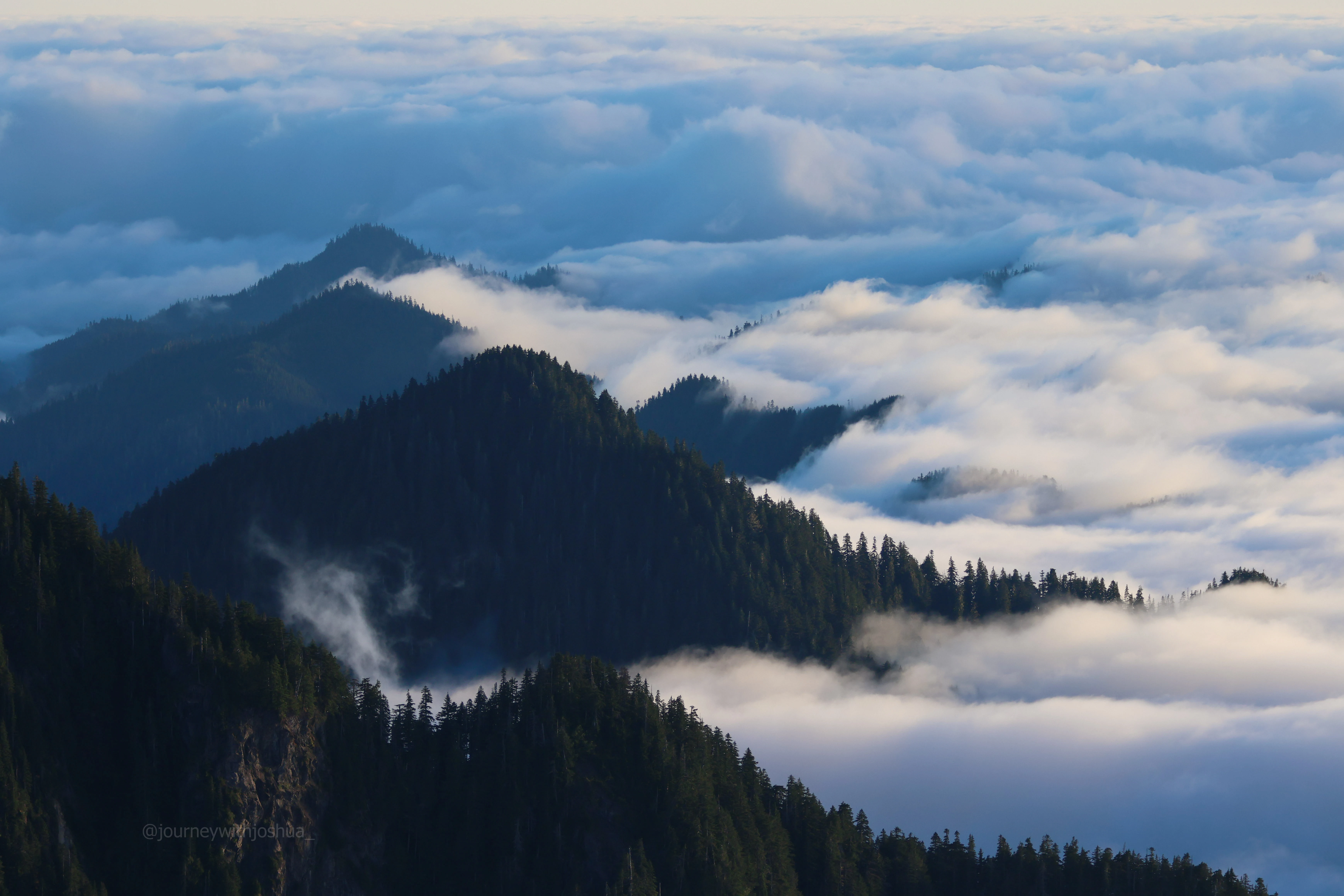 Incredible clouds rolling through the peaks of the Olympic Range.