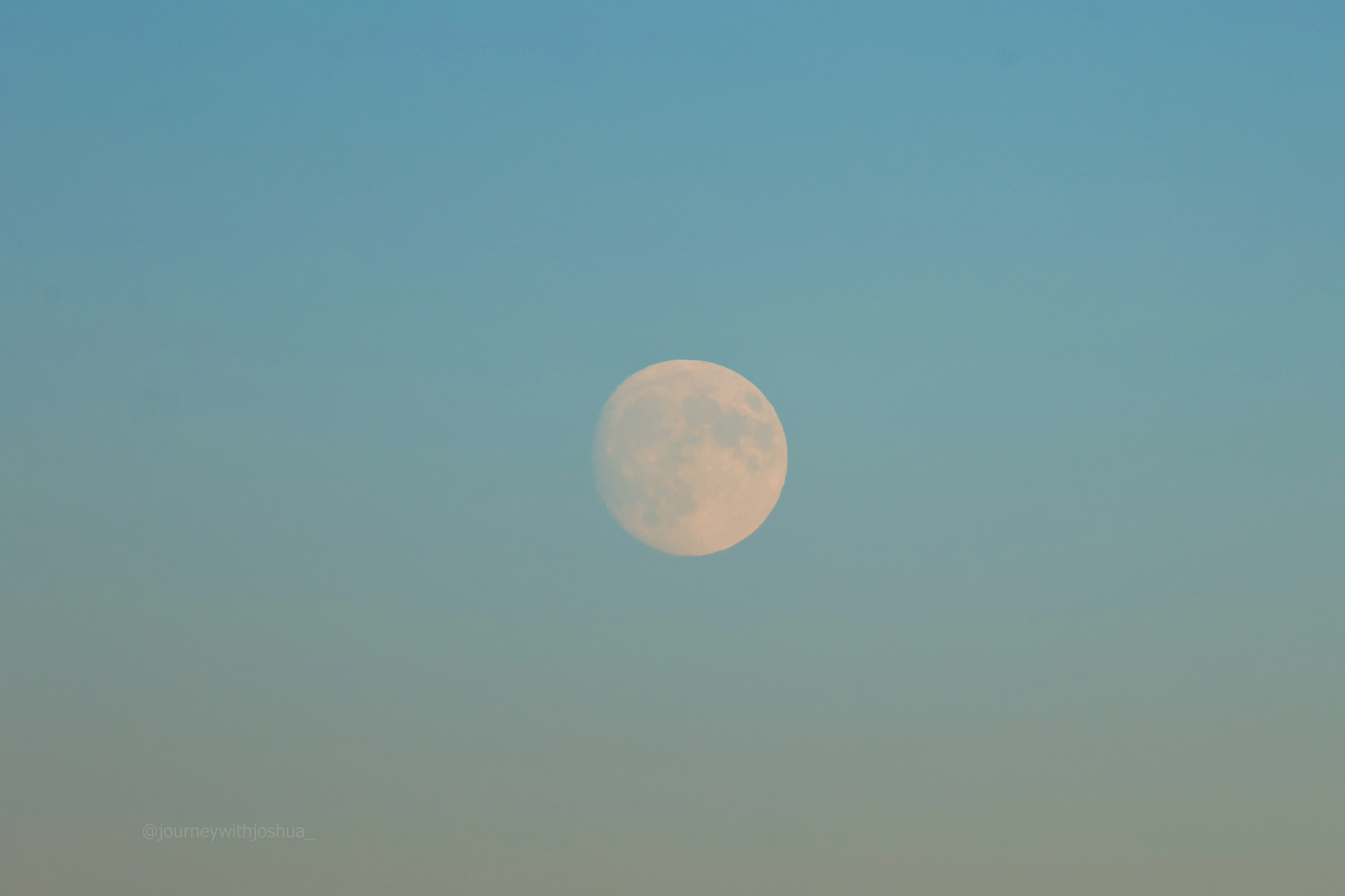 Moon close-up during sunset over the Olympic Range.
