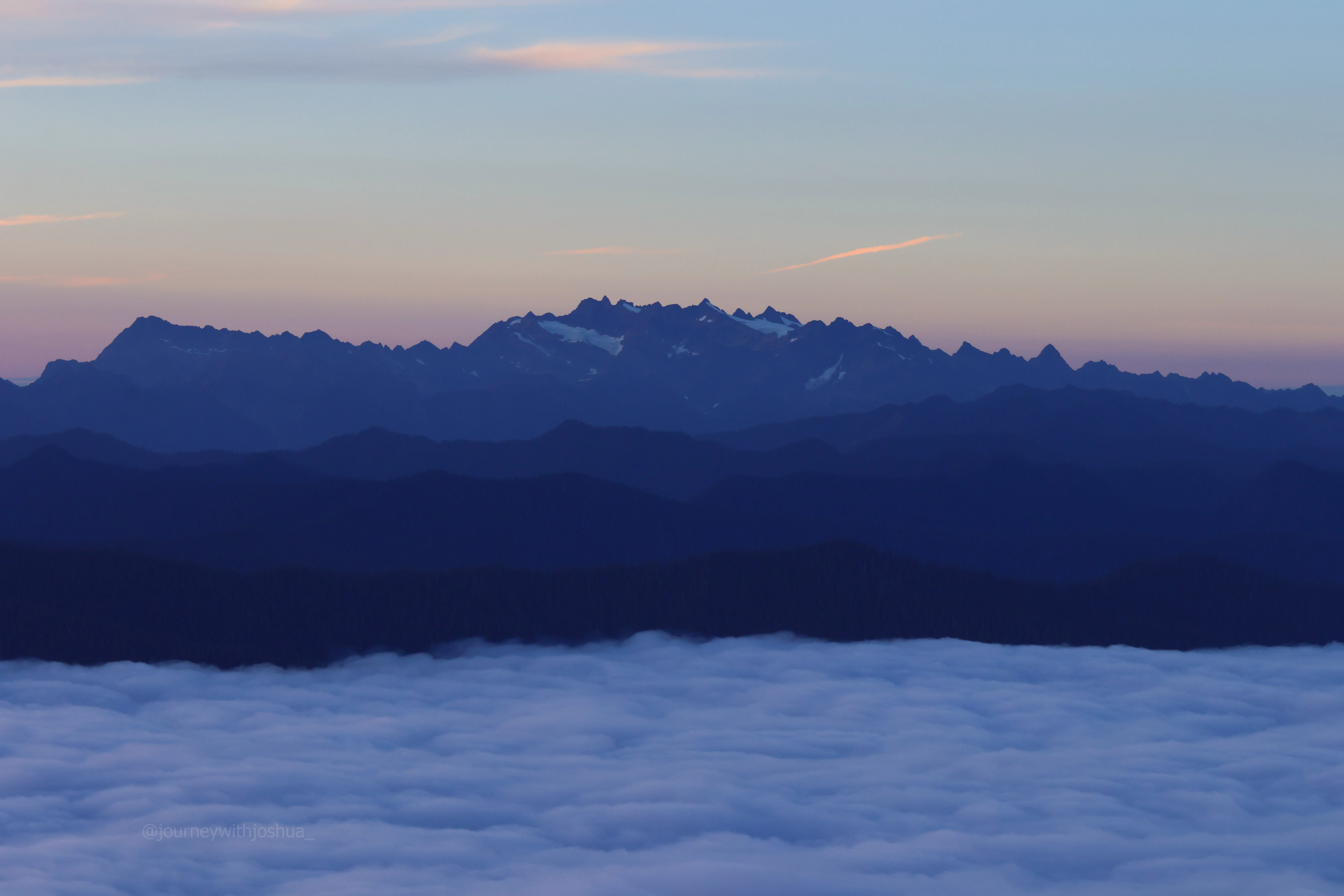 Blue layers of Mount Olympus at sunset from the Olympic Range.