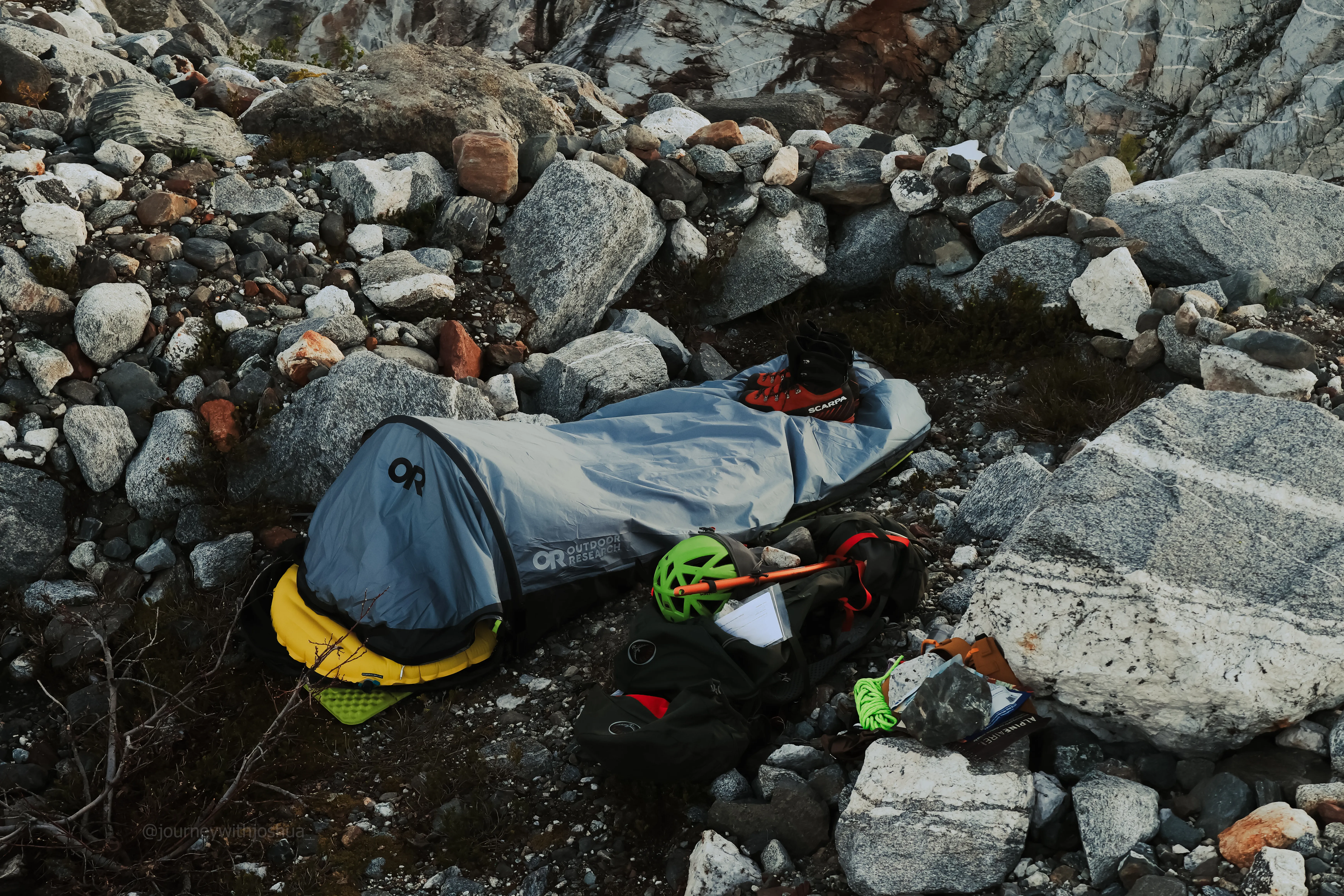 An up-close look at my bivy site with the stone wind wall I built