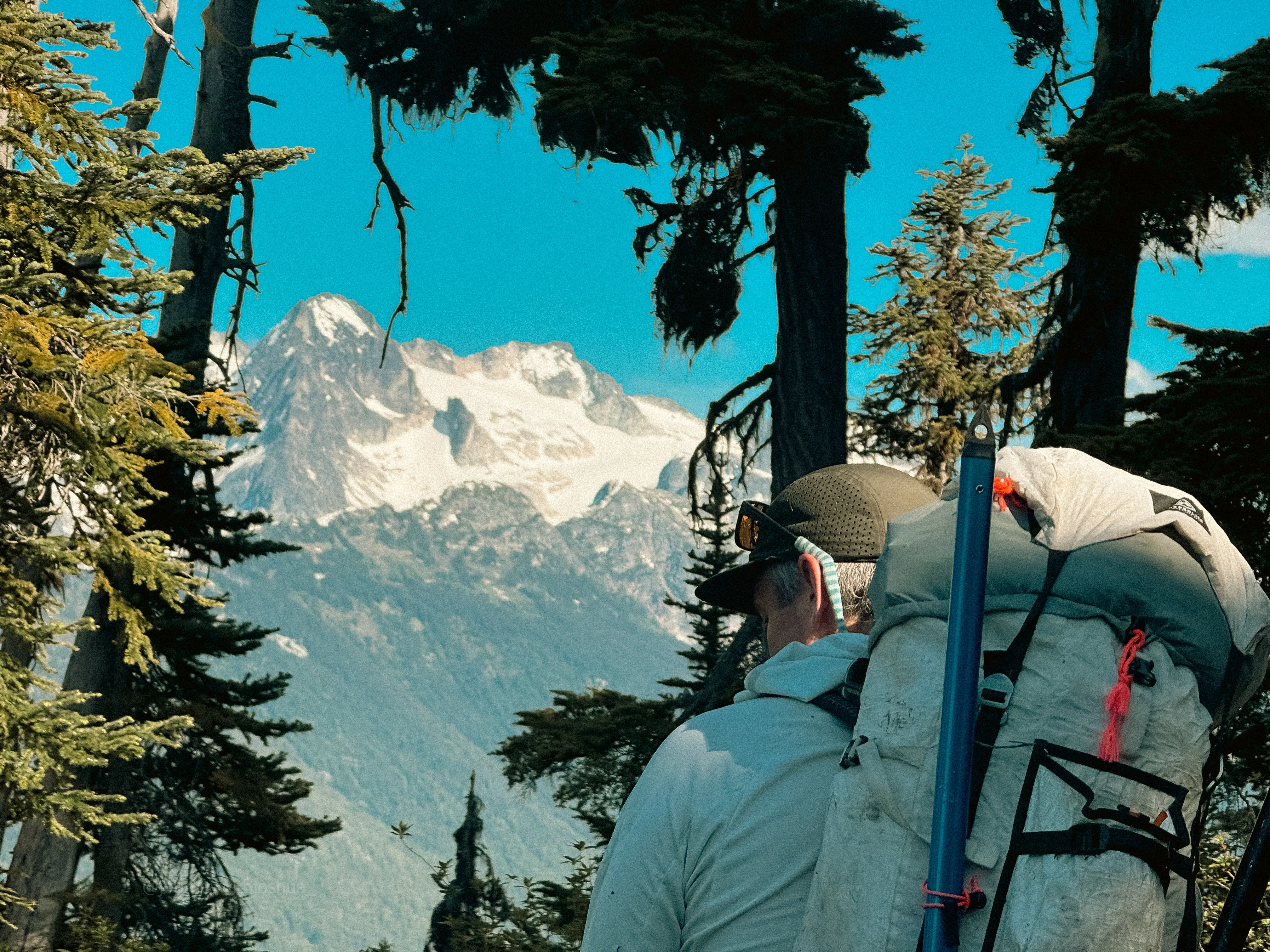 Chris spotting Tricouni Peak from the ridge