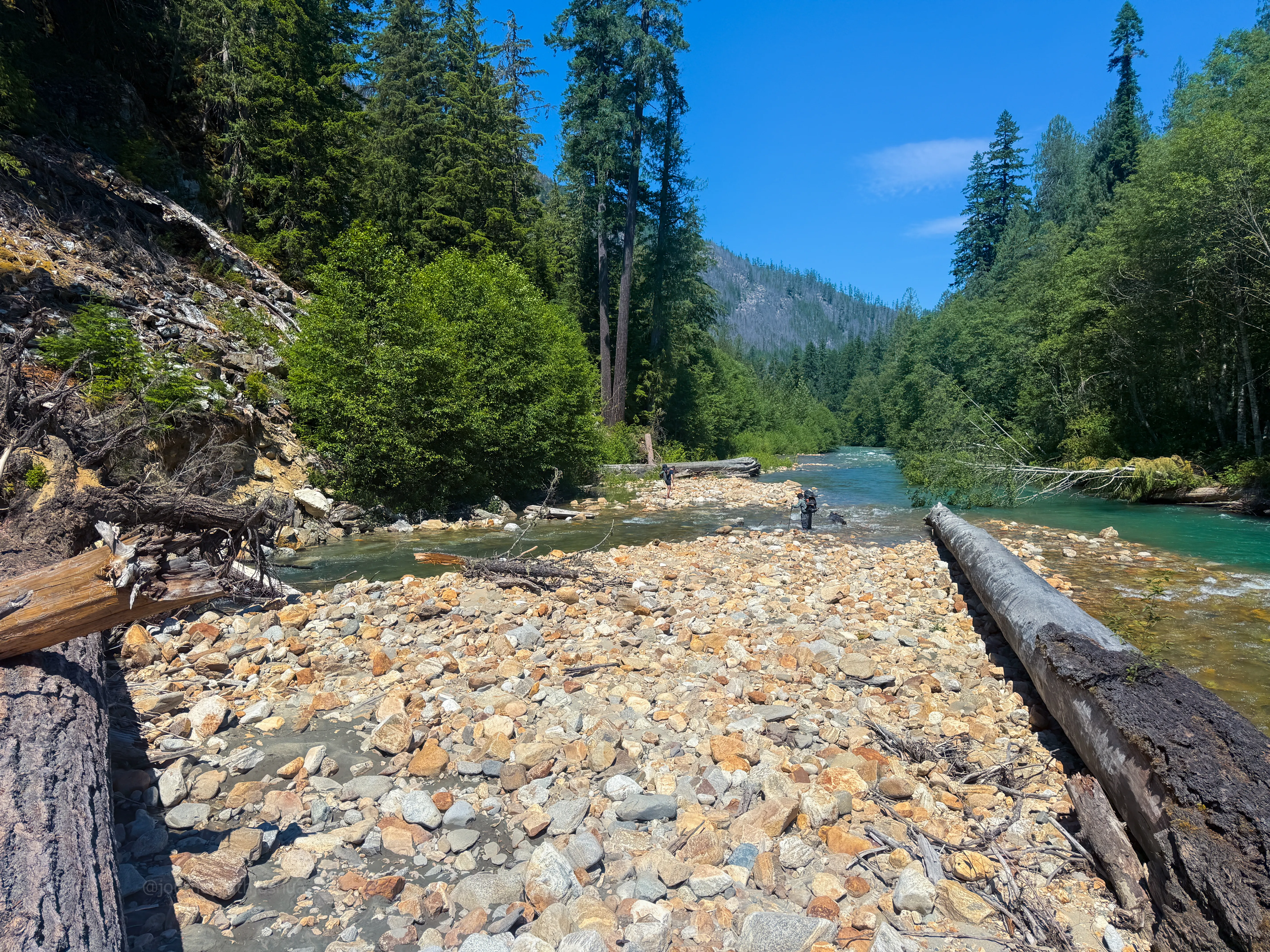 The two options at the end of the log jam: hug the bank left, or recross a short deep channel