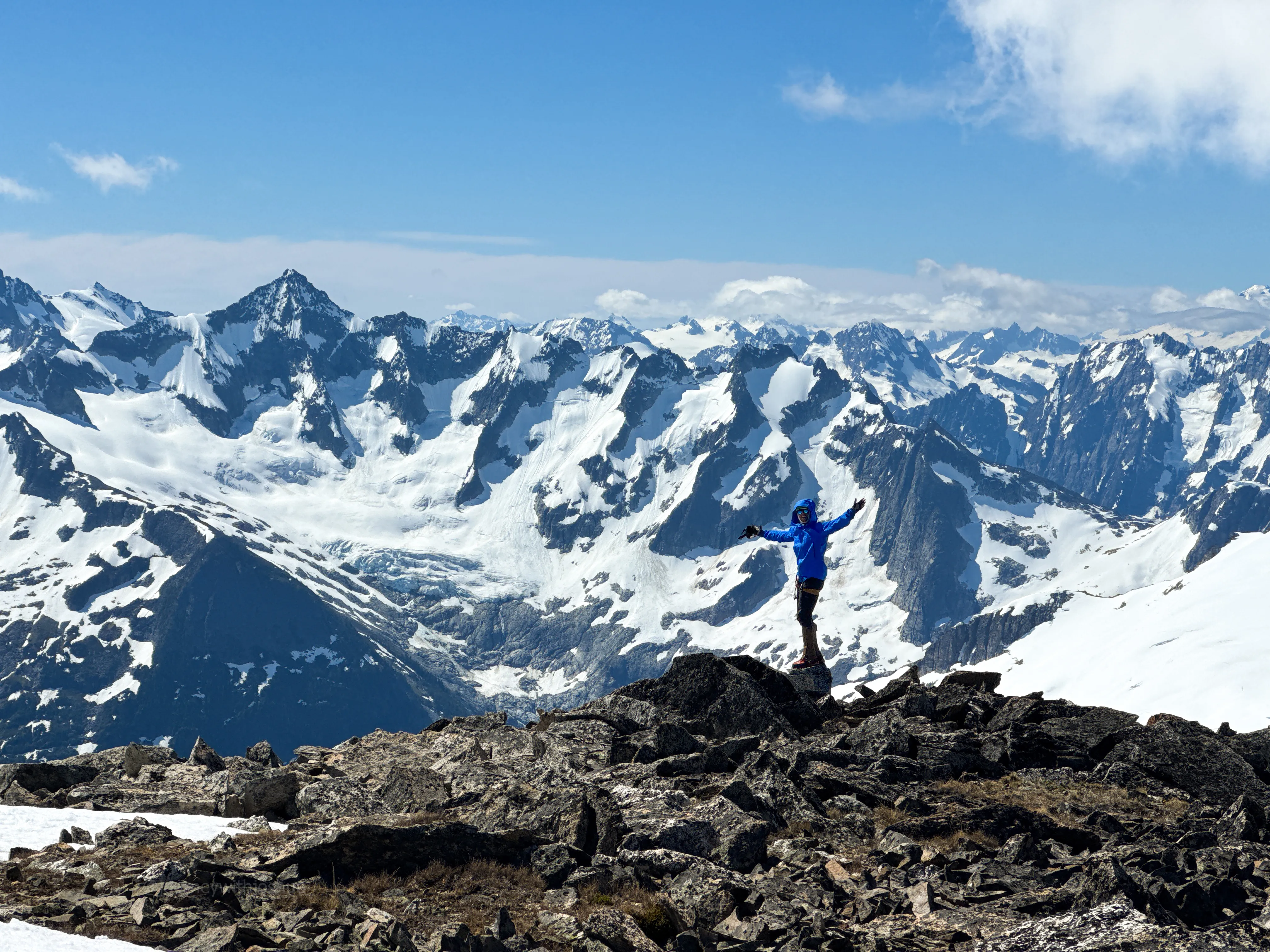 Joshua on the summit of Primus in front of the Torment-Forbidden Traverse