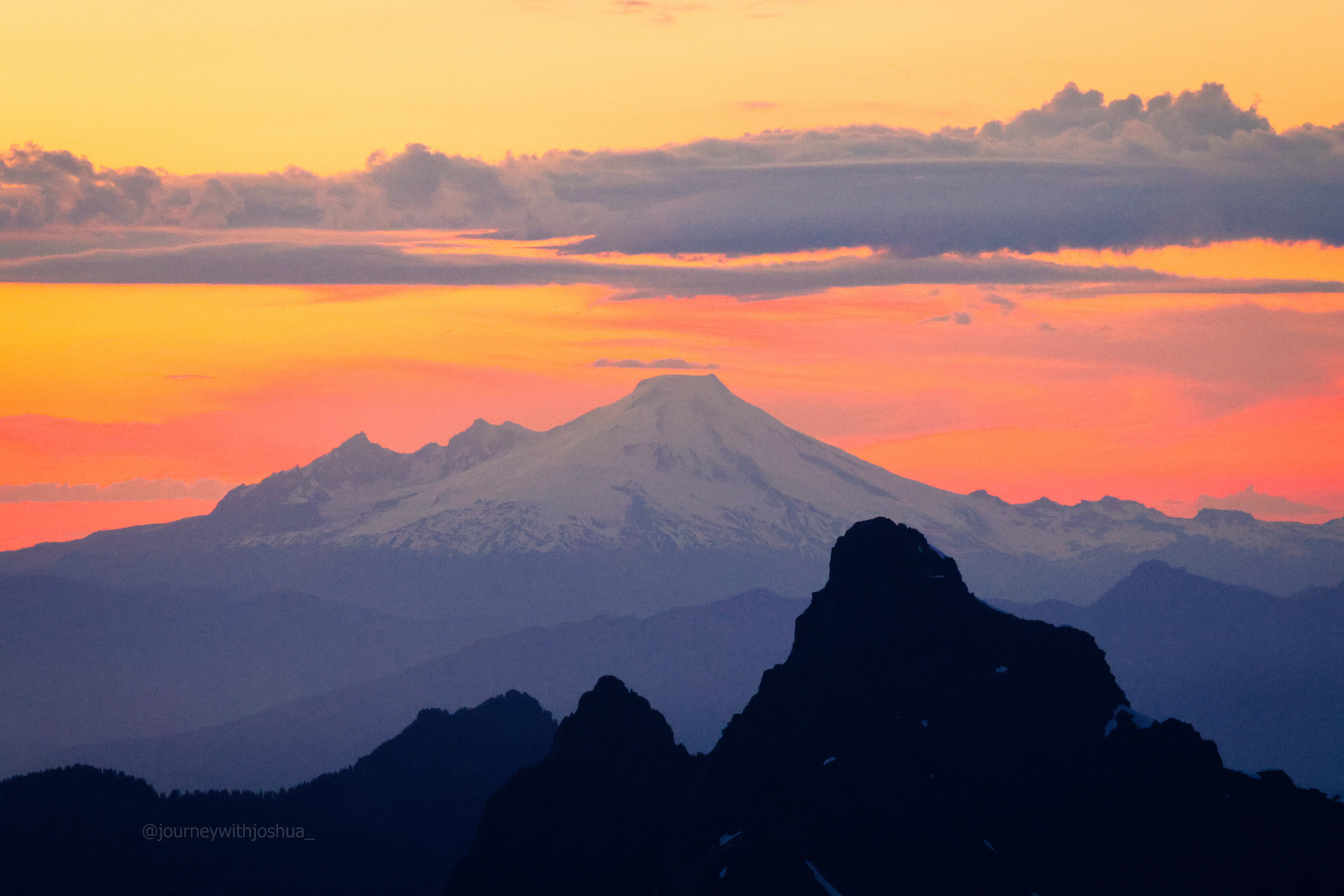 Mount Baker and White Chuck Mountain in stacked ridgelines