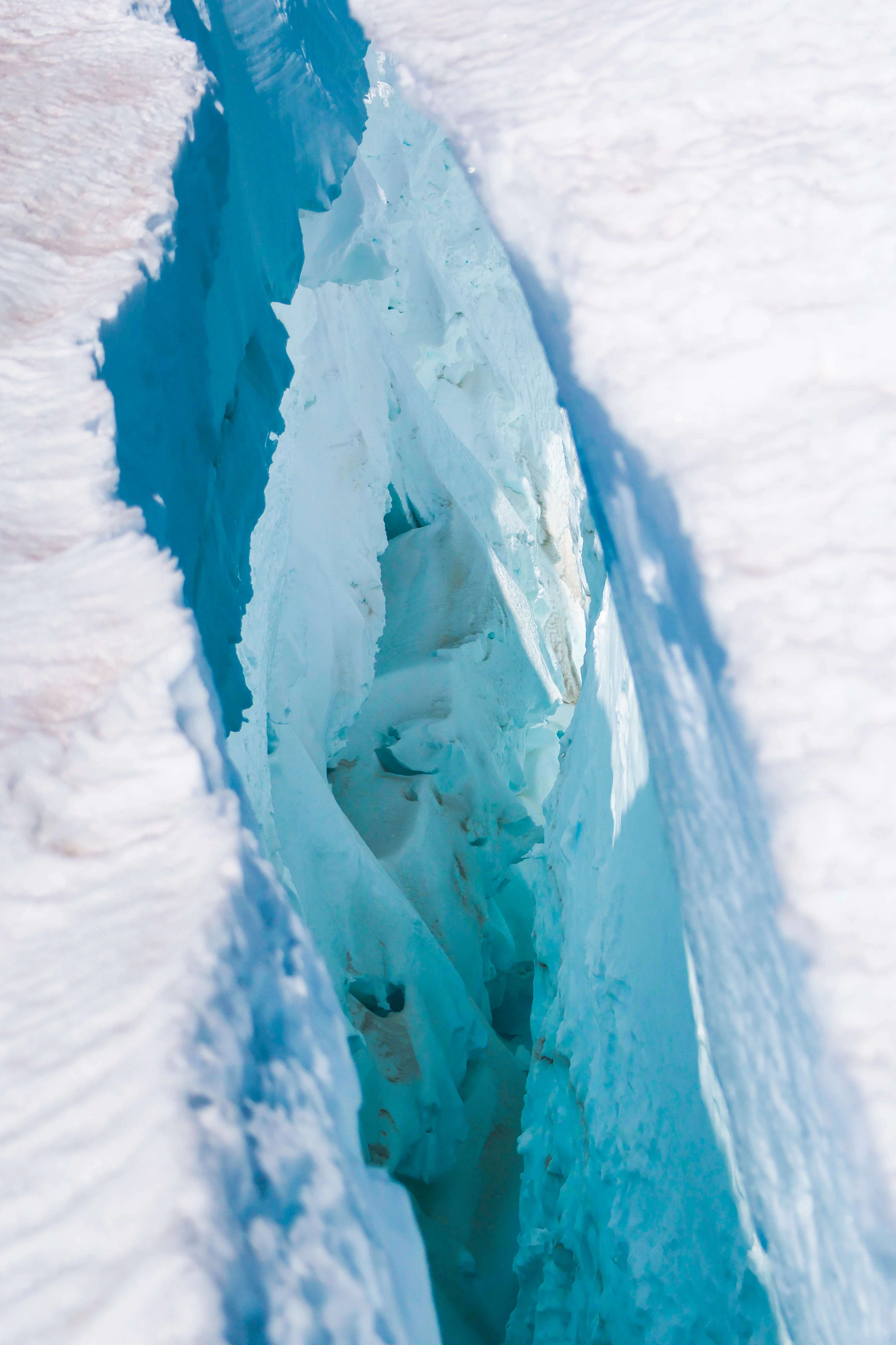 Deep blue crevasses in the glacier