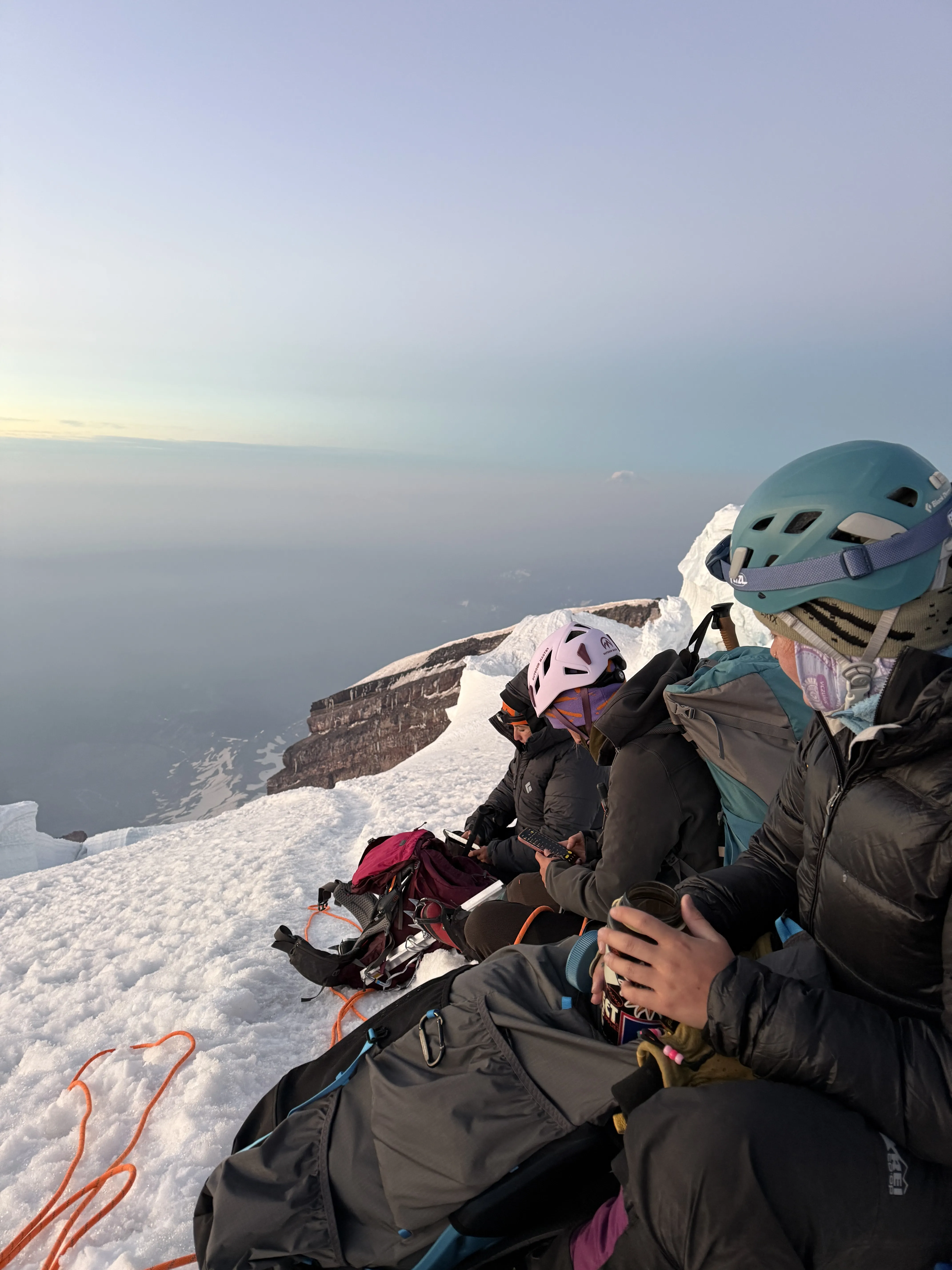 The team navigating the upper mountain at sunrise