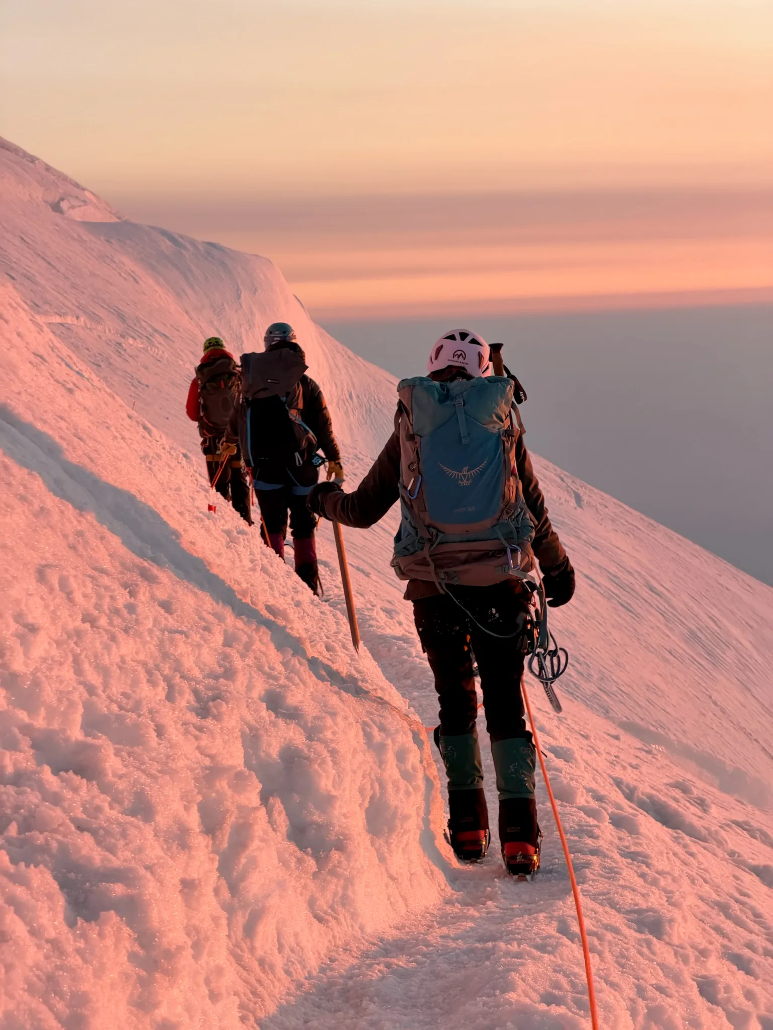 The team resting just after sunrise on the upper mountain