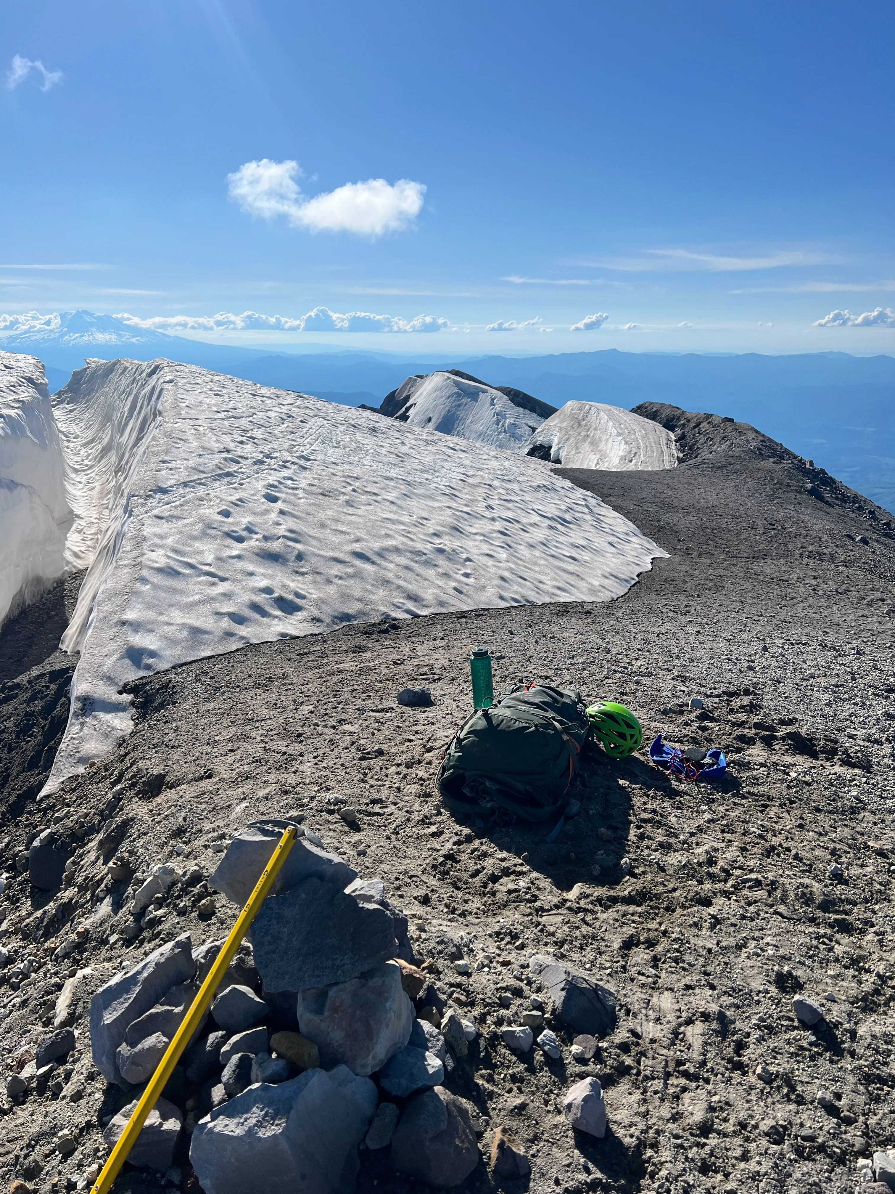 My summit nap spot tucked beside a deep split in the cornice