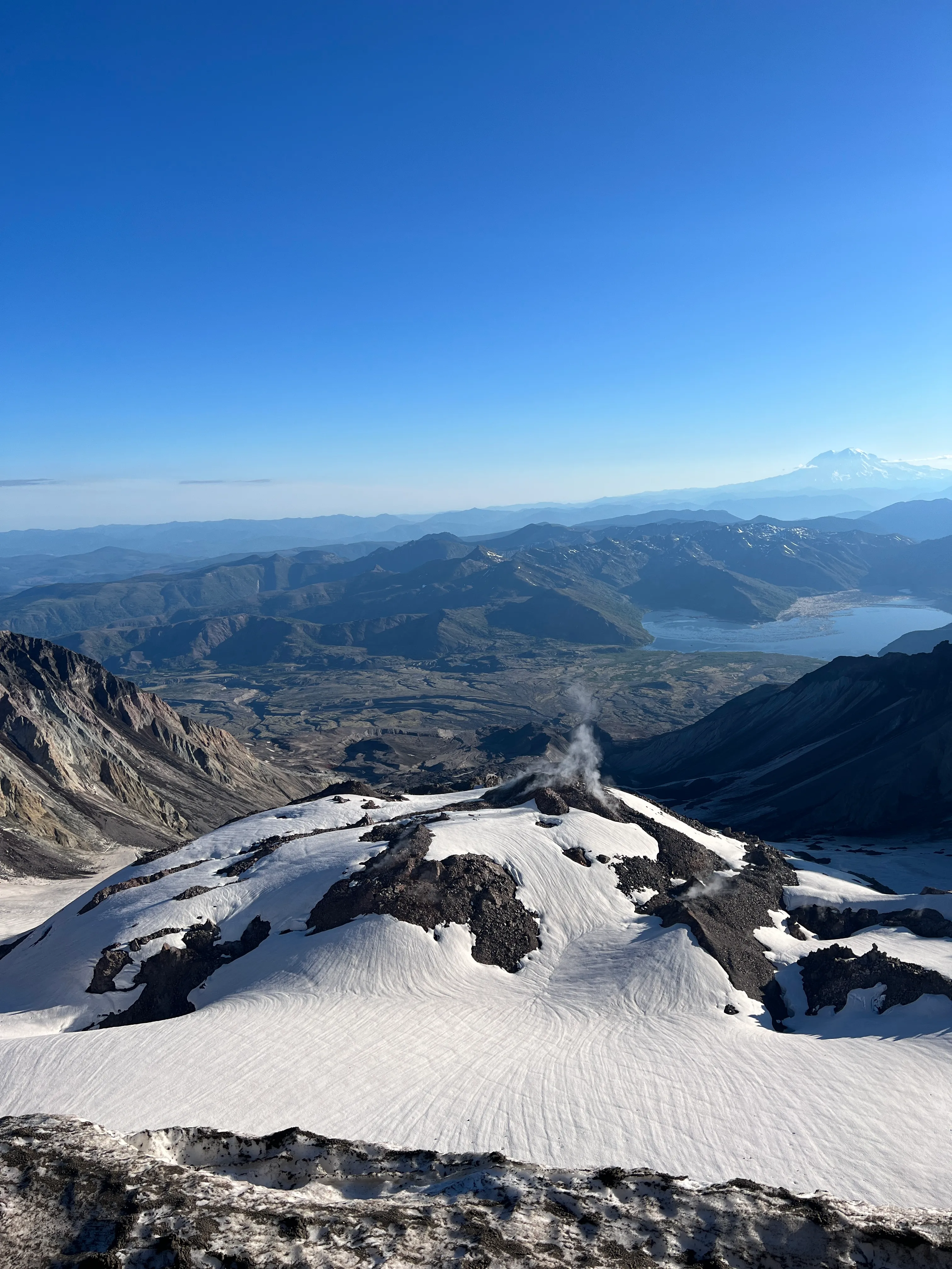 Volcanic gas with Mount Rainier behind Spirit Lake for scale
