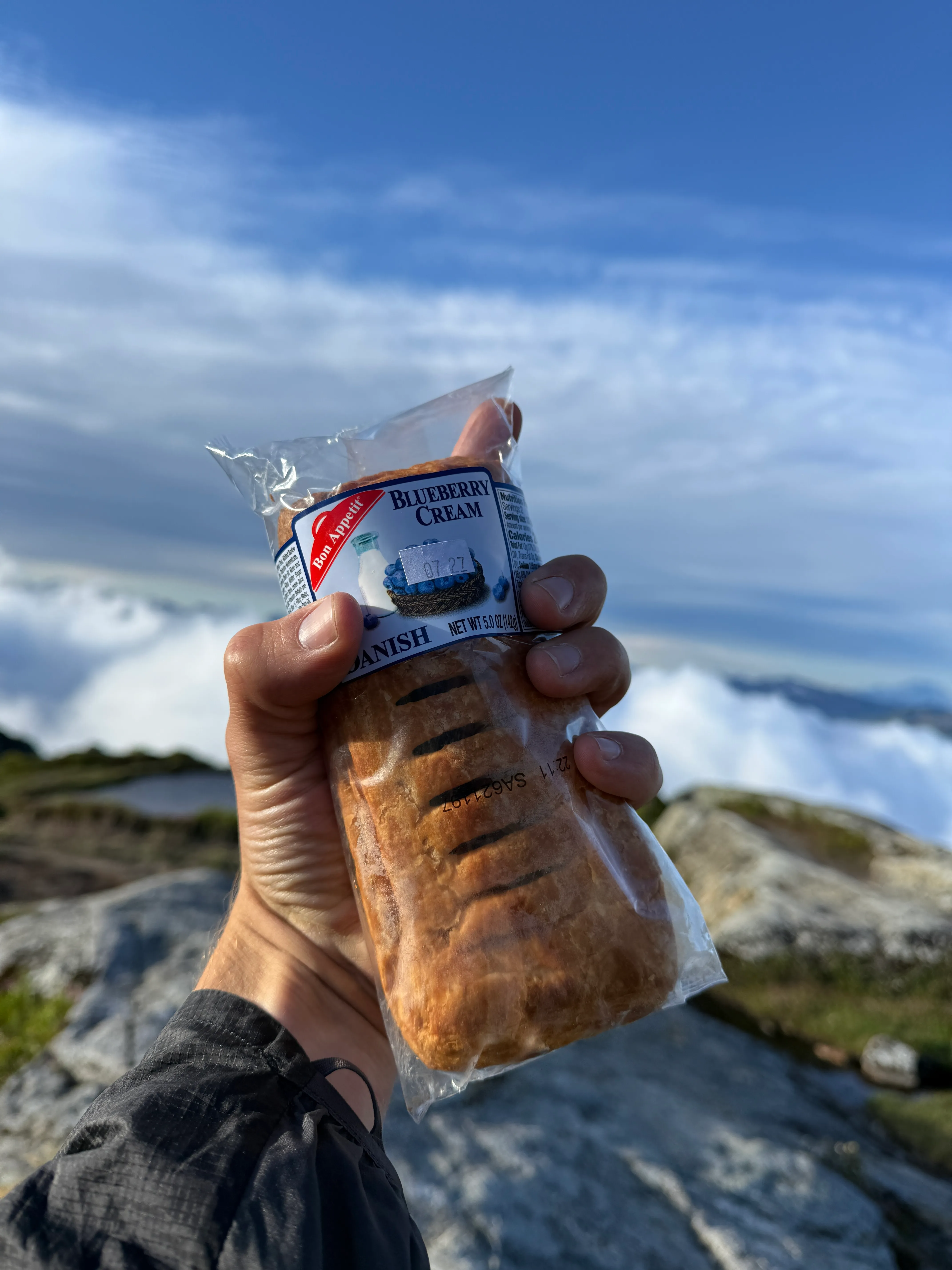 Packs down and taking in the summit views