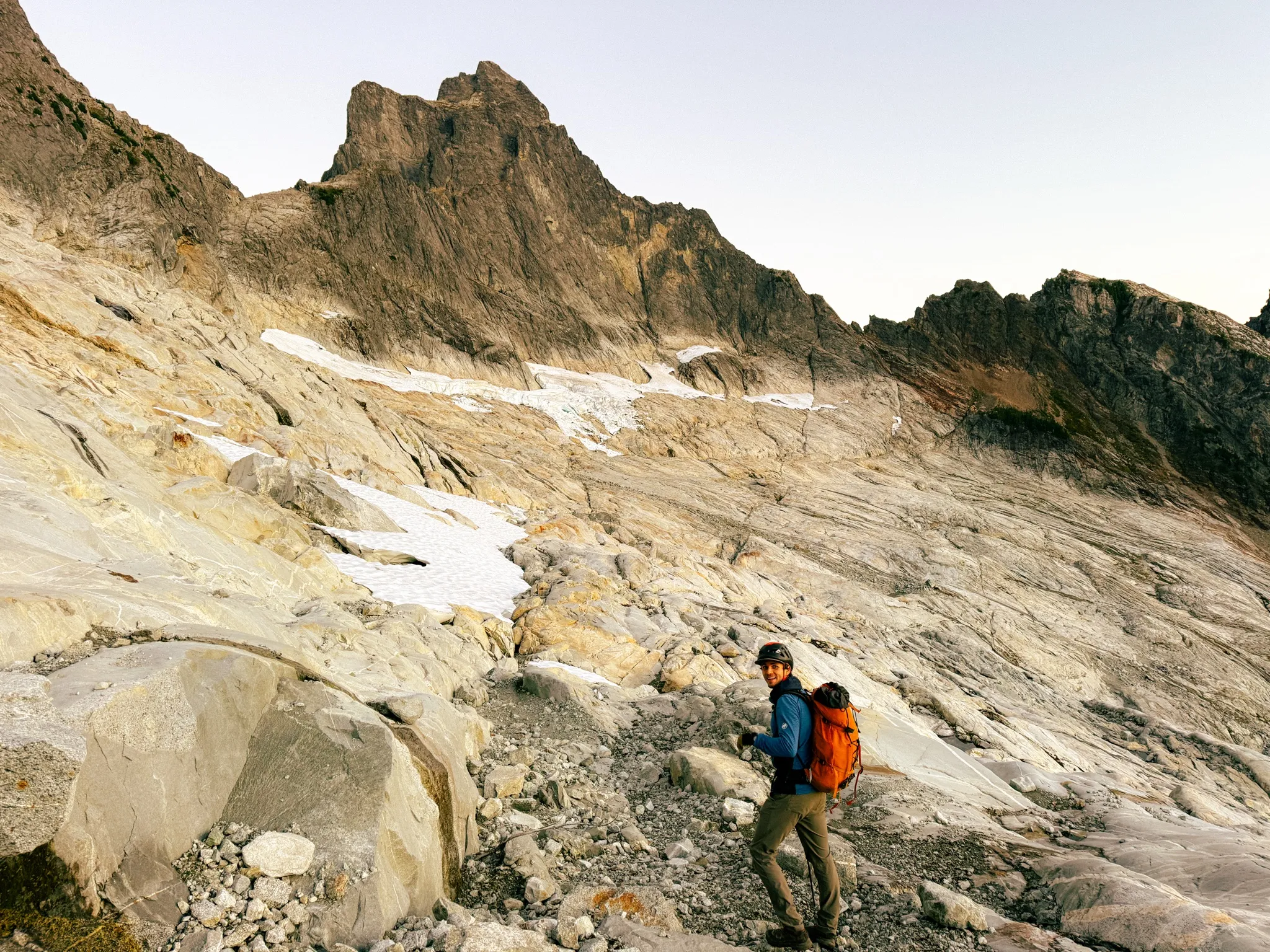 Adam happy to be off the choss, the deep gully lies ahead on the Mount Triumph approach to the ridge