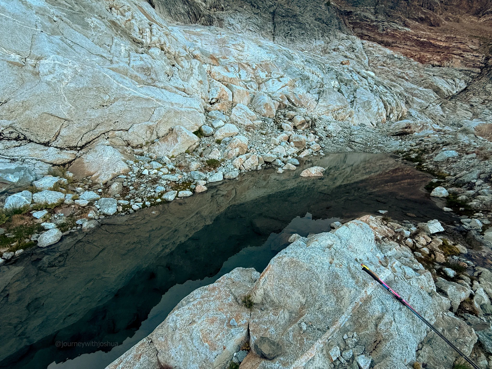 Back to the tarn and the poles to chug some water on the descent of Mount Triumph