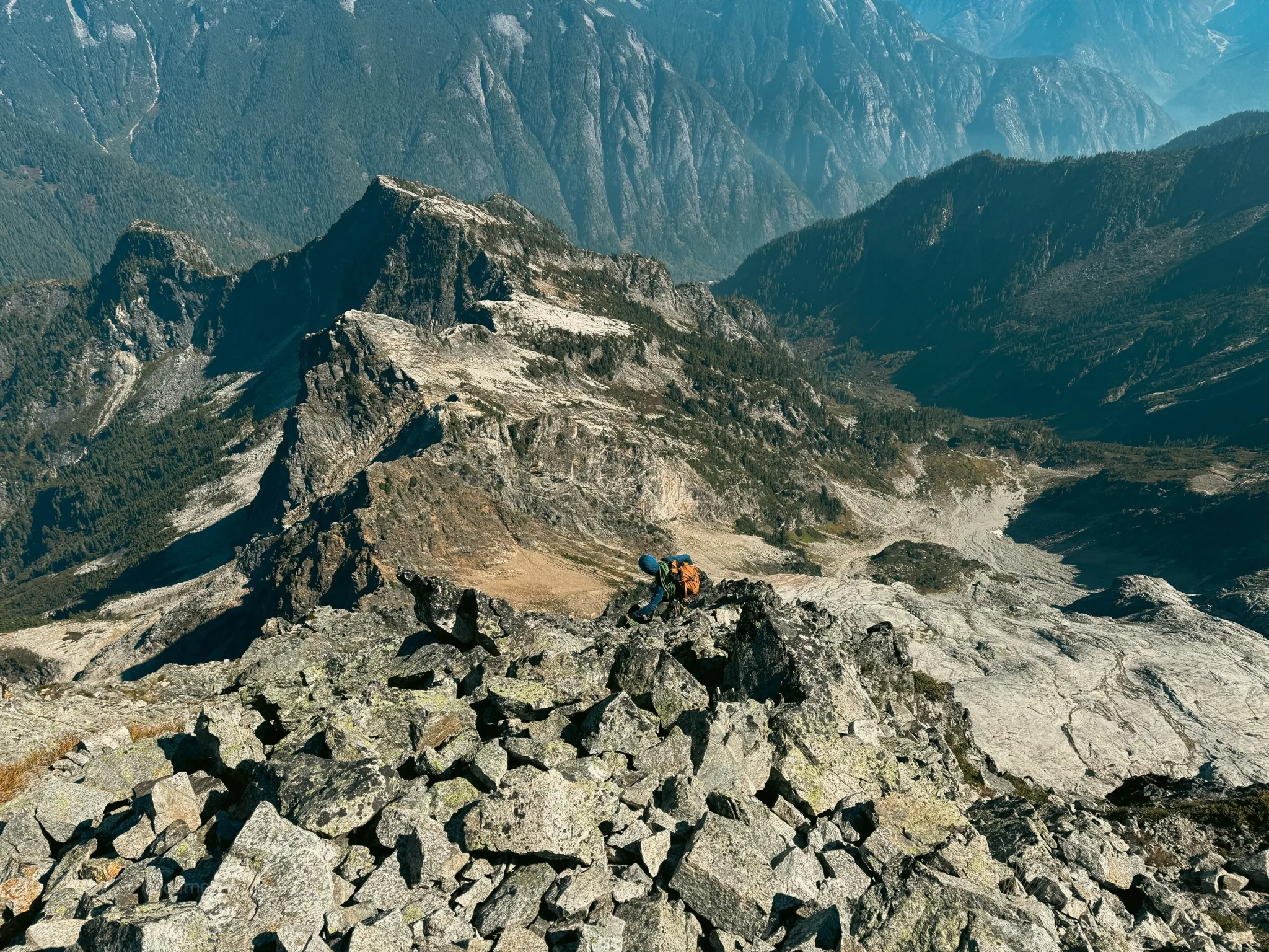 Downscrambling begins with the whole Northeast Ridge of Mount Triumph below