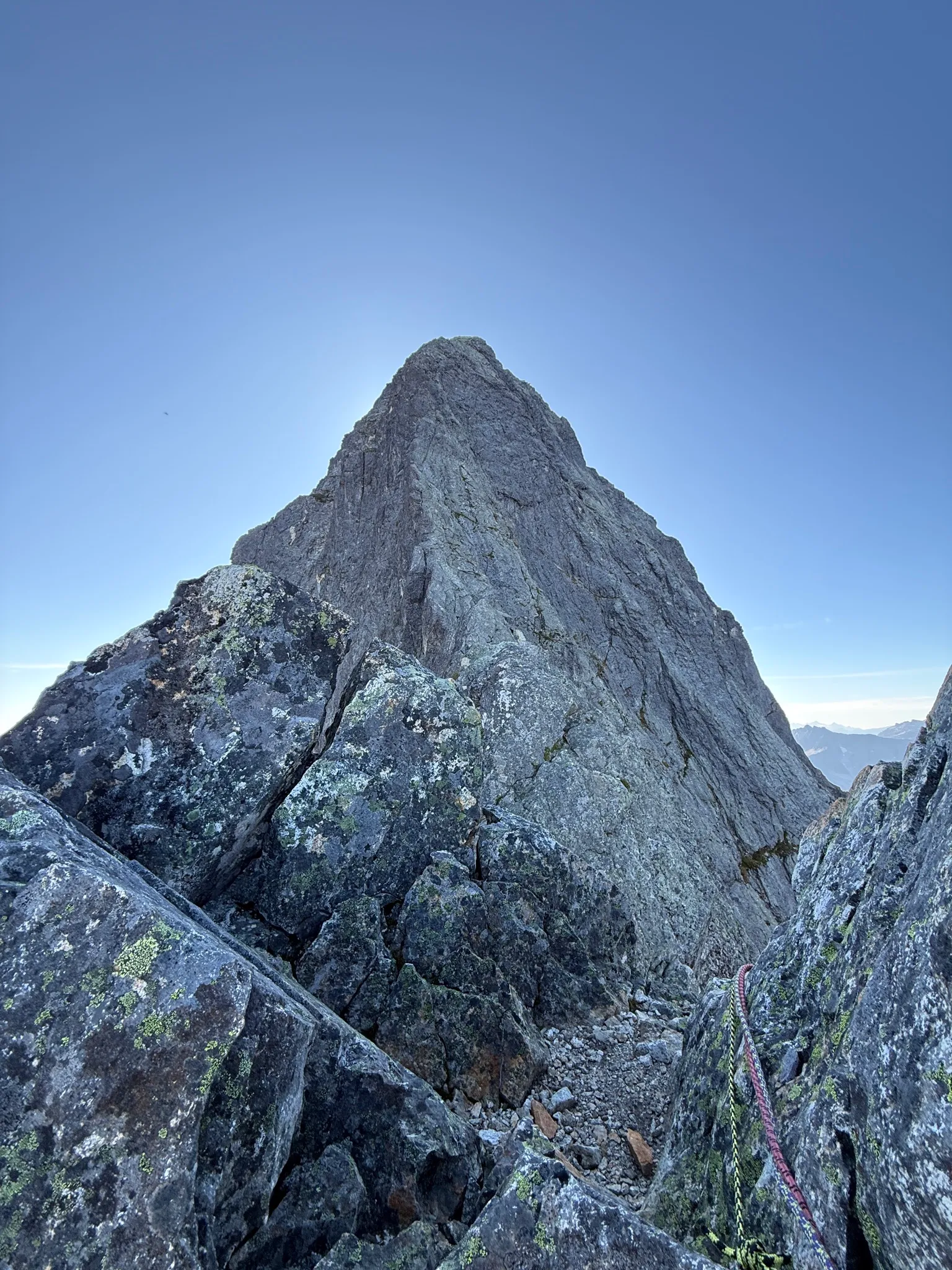 One last look back at the upper ridge and summit of Mount Triumph before heading down onto the easier sections