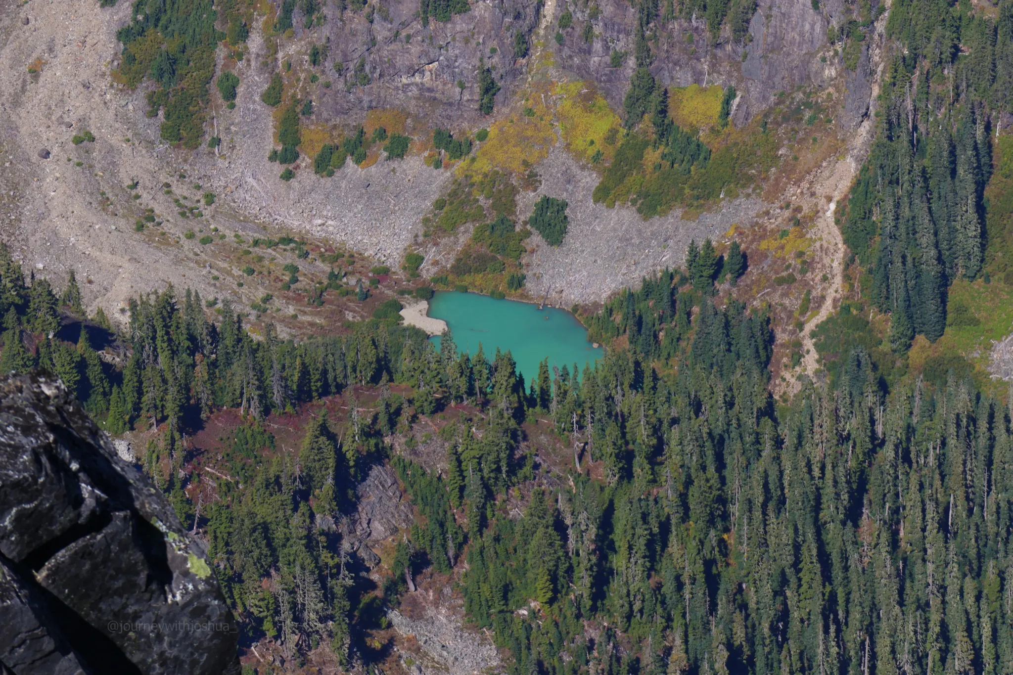 A Gatorade lake spotted below Mount Despair from the summit of Mount Triumph