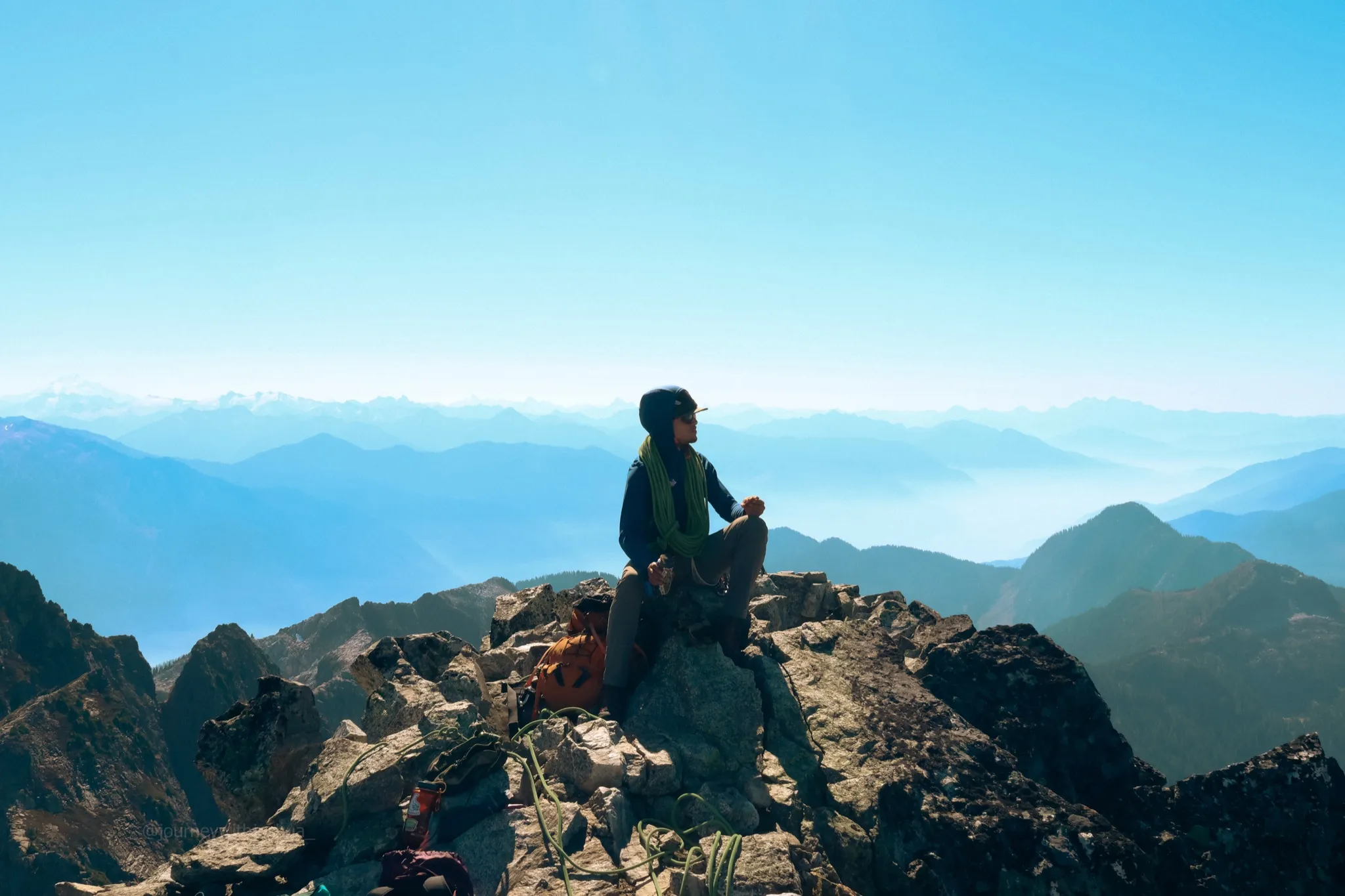 Adam fueling for the long descent ahead at 7,240 ft on the summit of Mount Triumph