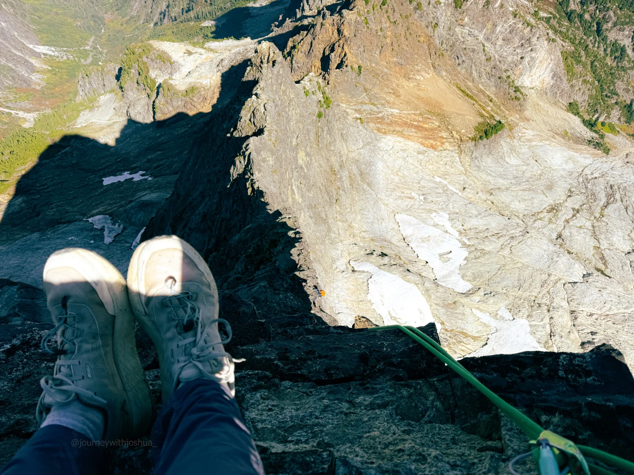 Looking down on the Northeast Ridge of Mount Triumph from a midway rappel on the descent